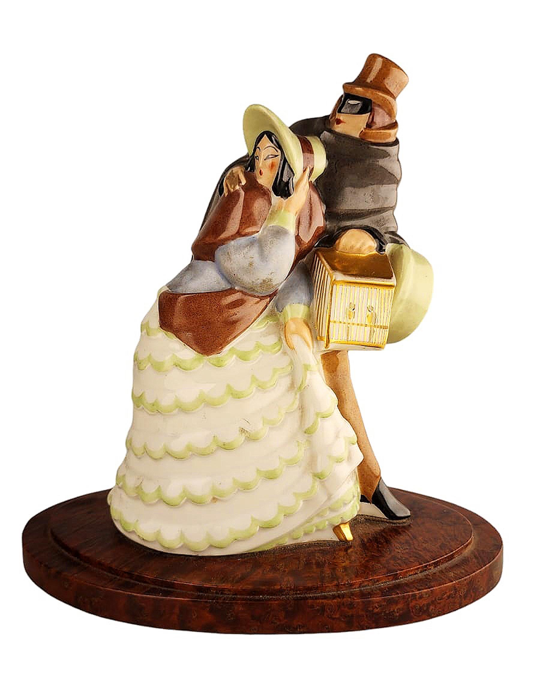 Early 20th century Art Déco perfume lamp of dressed up lady and masked man with cloak by Argilor from Paris, France

By: Argilor
Material: ceramic, paint, wood, enamel, cord
Technique: molded, pressed, carved, hand-carved, hand-crafted,