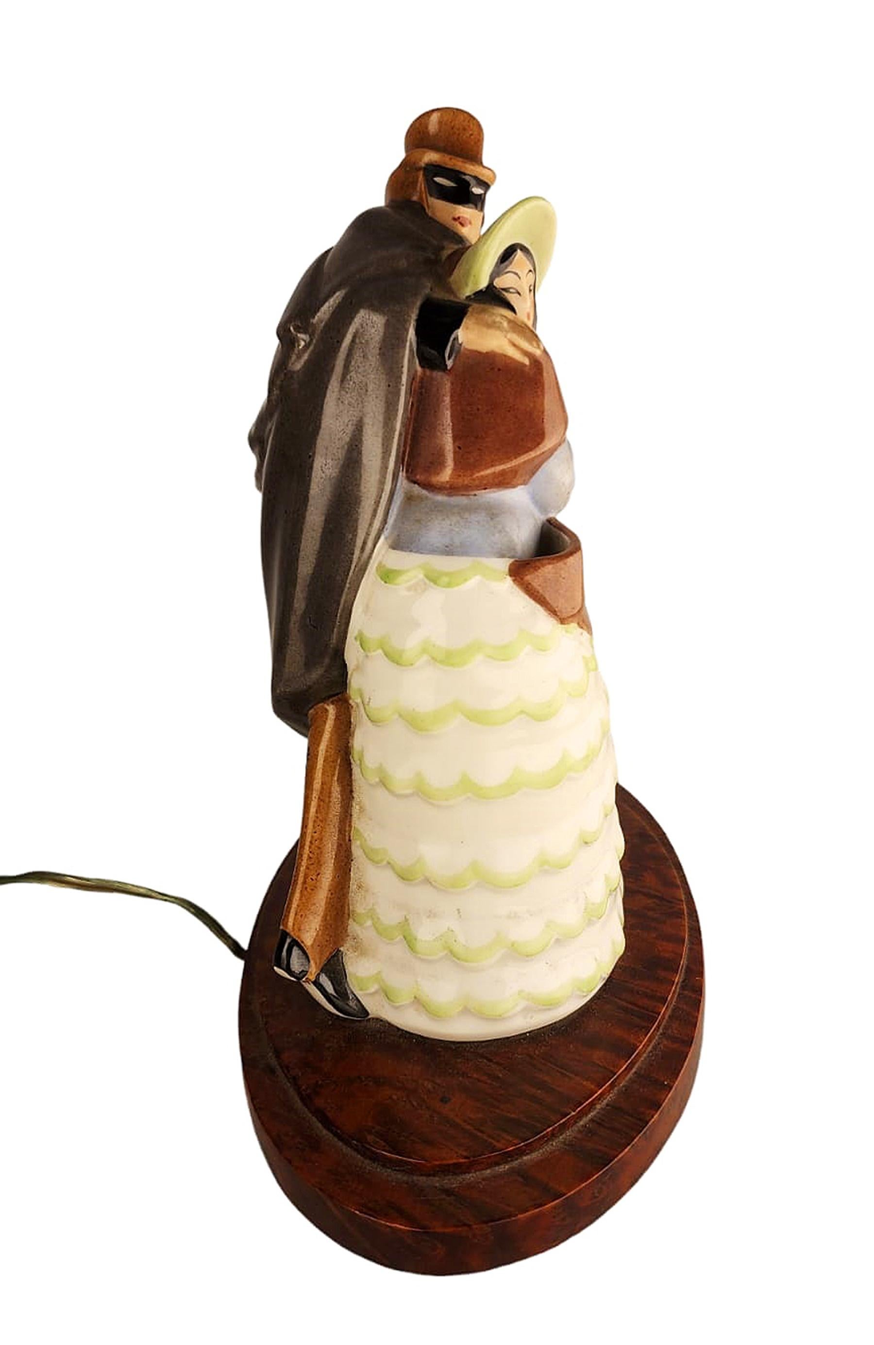 Carved Art Déco Perfume Lamp of Dressed Up Lady and Masked Man with Cloak by Argilor For Sale