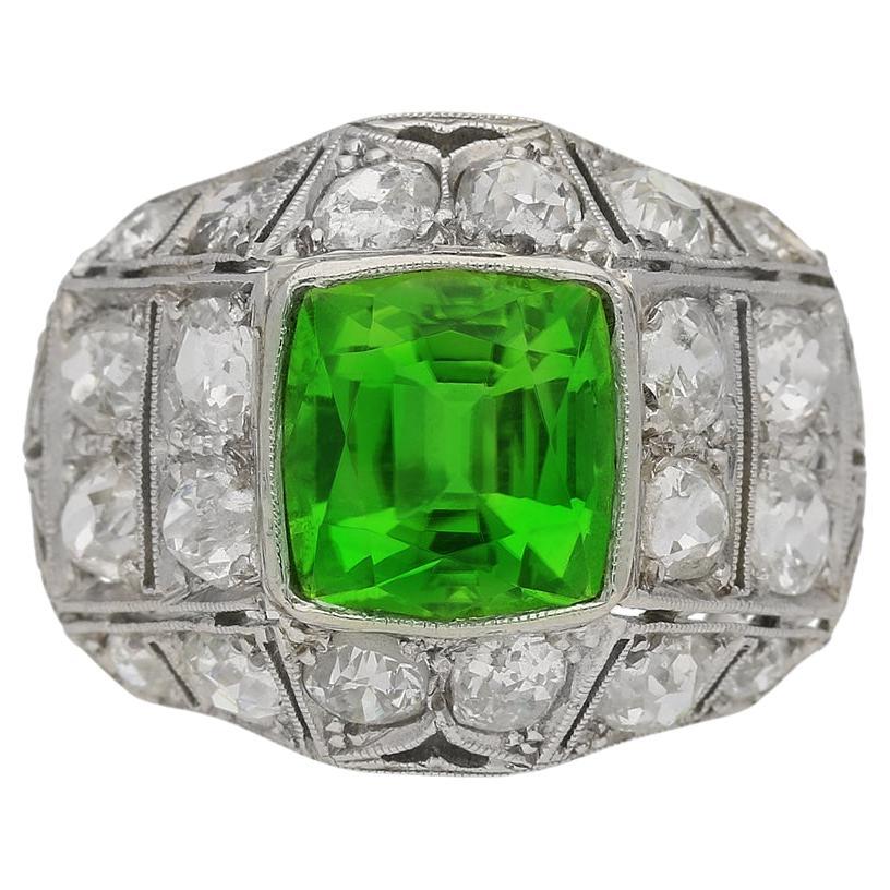 Art Deco peridot and diamond cluster ring, circa 1920. For Sale