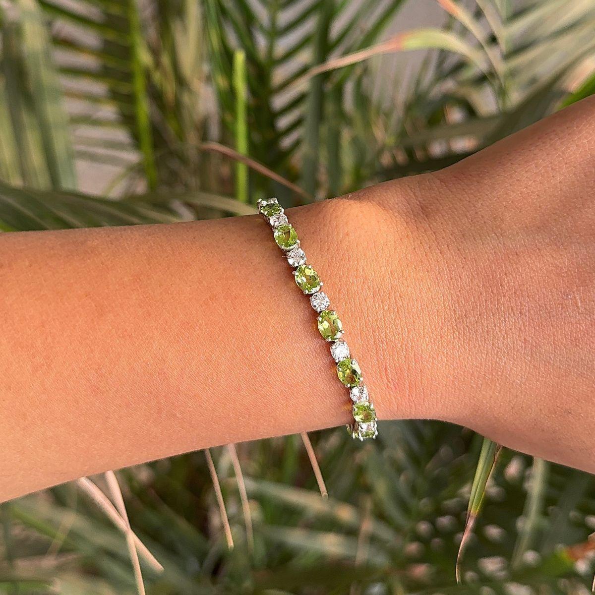 Art Deco Peridot Tennis Bracelet in sterling silver. You shall need statement tennis bracelet to make a statement with your look. Each piece features dazzling cubic zirconia stones, renowned for their brilliance and clarity, set in high-quality