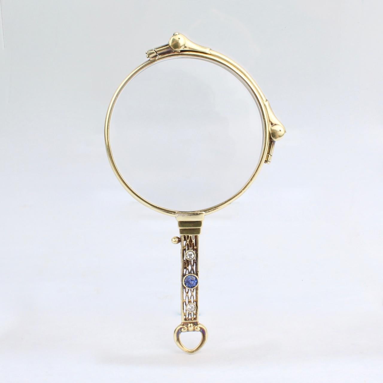 A wonderful Art Deco period 14-karat gold lorgnette. 

The openwork handle set with a 38mm diameter round cut sapphire and two .07ct round cut accent diamonds.

Still perfectly functional as reading glasses and simply beautiful Deco design!

Marked
