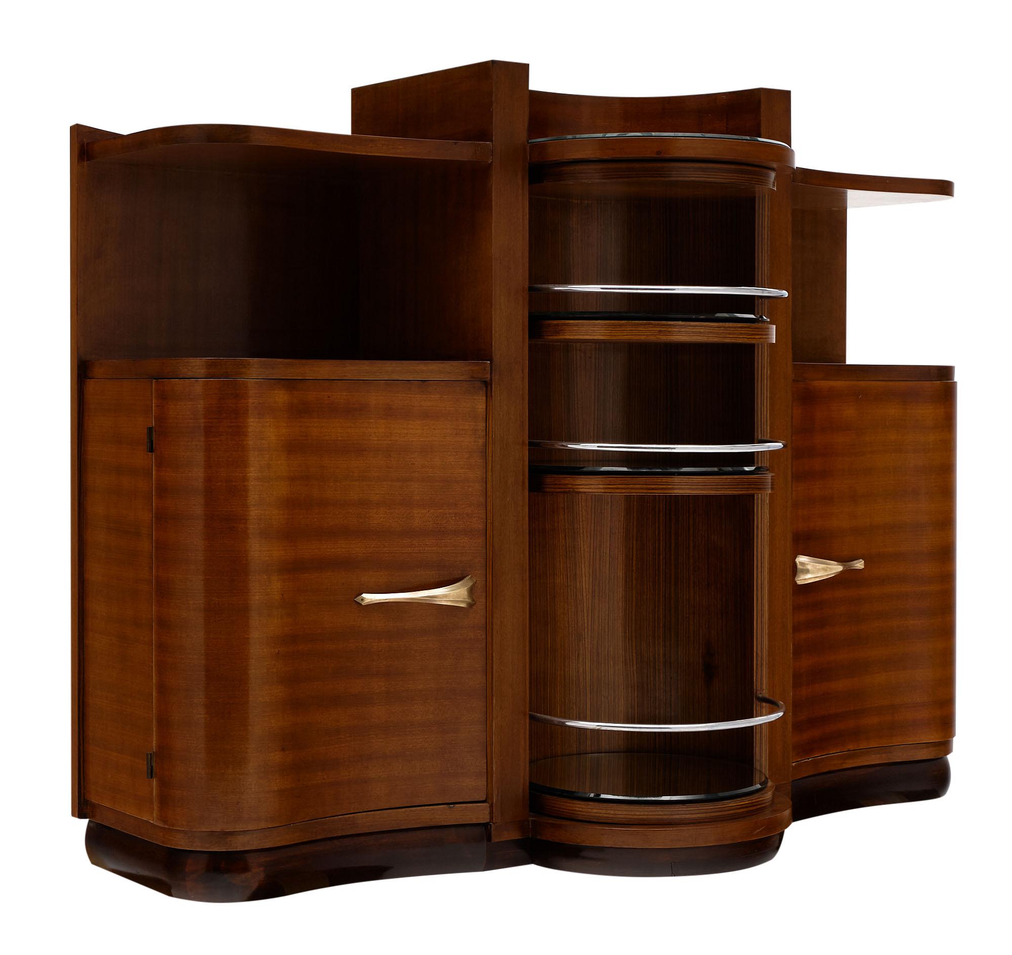 Bar cabinet - Art Deco period bar cabinet from France made of walnut with a rotating central bar section. This piece features exterior shelving and additional shelving behind the doors. We love the curve of this elegant piece!