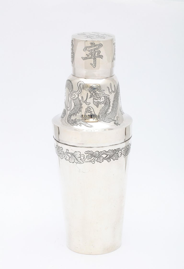 Sterling silver, Art Deco Period, Chinese Export cocktail shaker, China, Ca. 1920's, KL - maker's mark. Retailed at Guang Li in Shanghai. Measures 8 1/2 inches high (at highest point) x 3 1/2 inches diameter (at widest point). Weighs 8.150 Troy