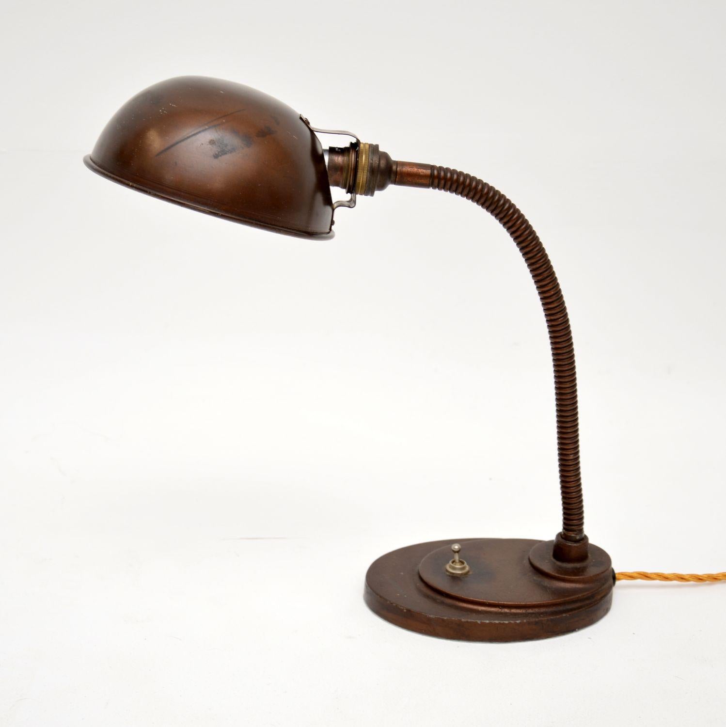 A fantastic original Art Deco period desk lamp. This was made in England, it dates from the 1930’s.

It is beautifully made from patinated copper we believe, though it may be brass with a very heavy patina. Either way it is a fabulous item, with an