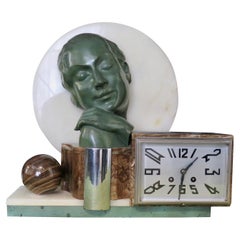 Horloge française d'époque Art Déco en bronze et onyx