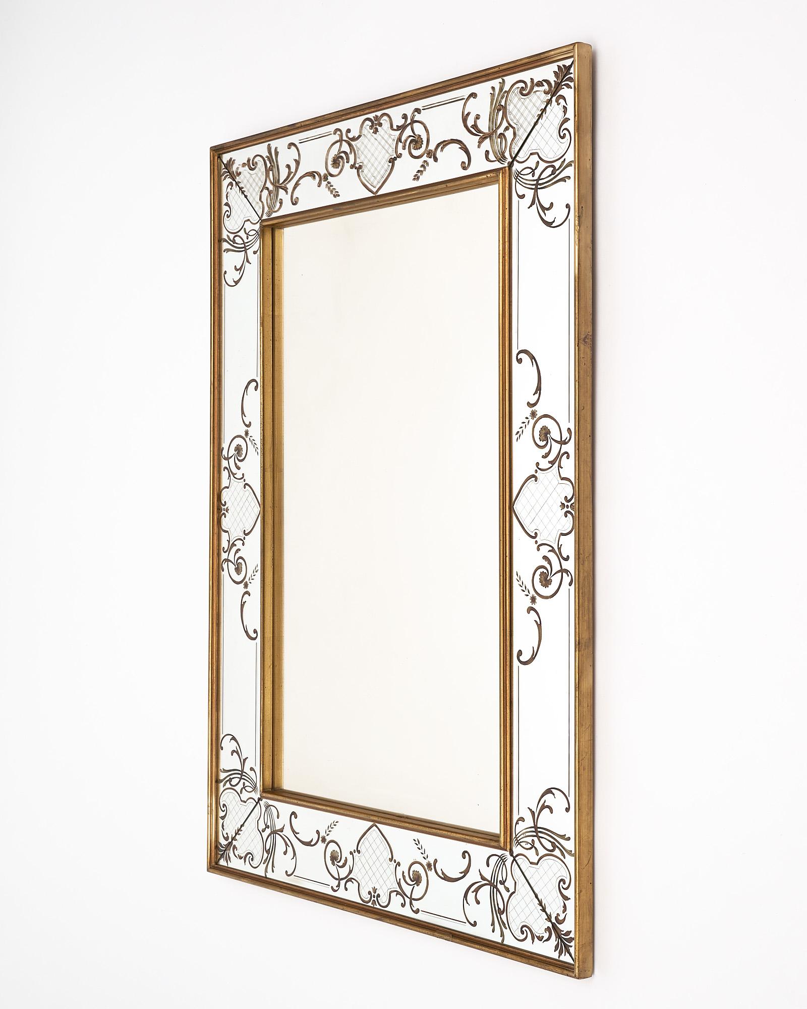 Mirror, French, made with eglomised and gold leafed frame. This piece is from the Art Deco period.