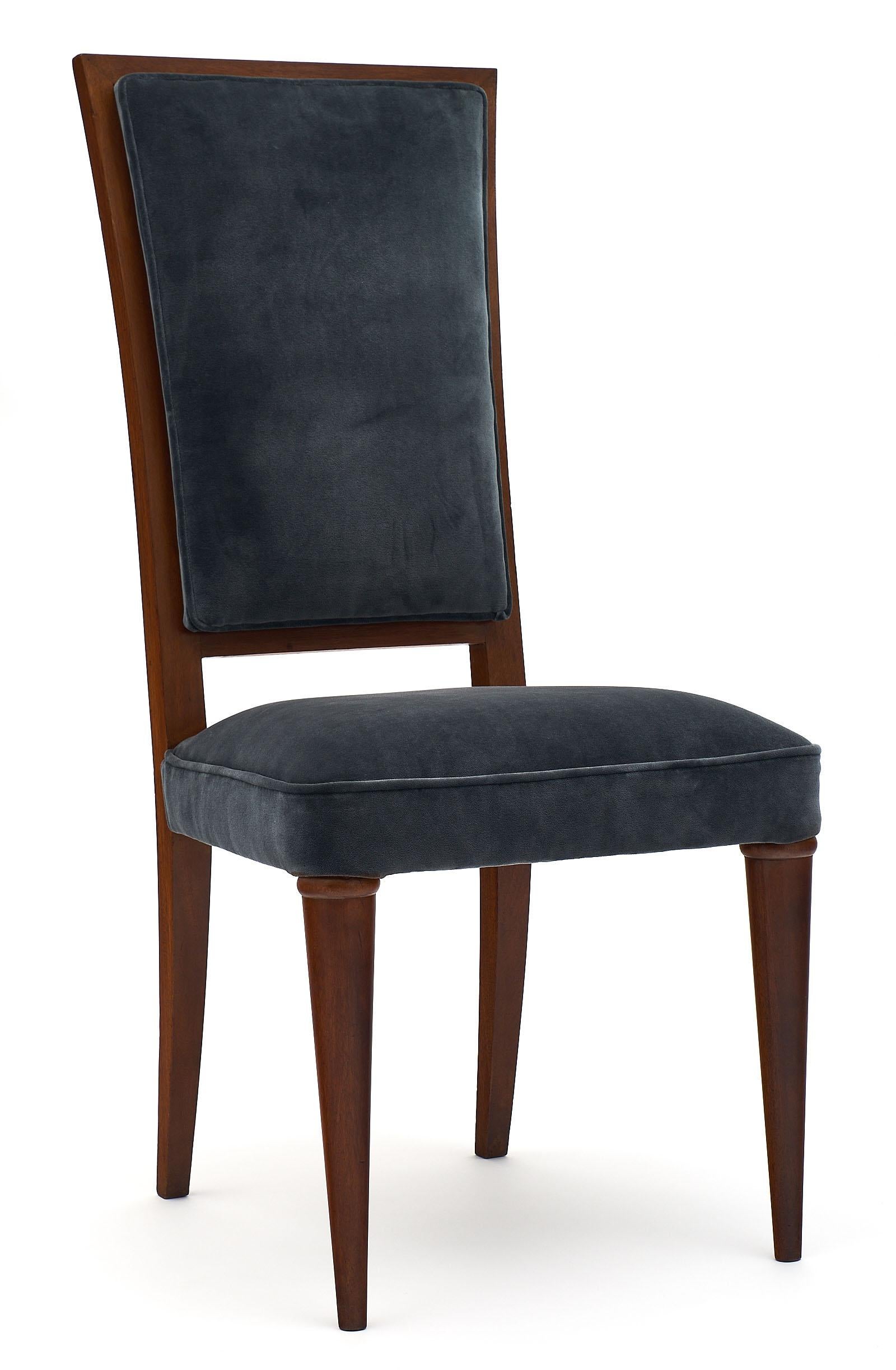 French Art Deco period mahogany chairs with very strong, comfortable frames. We love the high back and straight modernist lines. They have been newly upholstered in a dark gray cotton velvet blend.