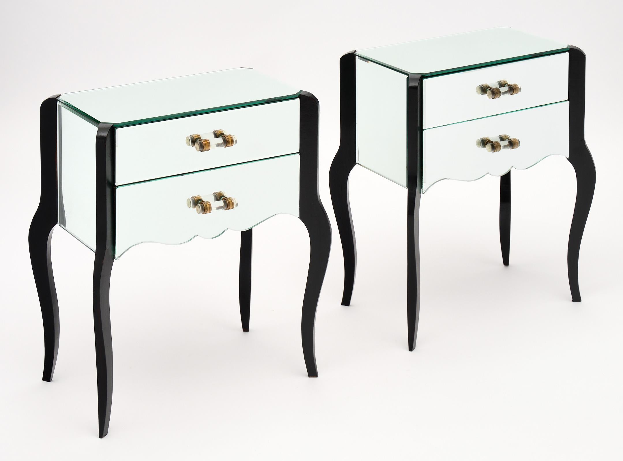 French Art Deco period mirrored side tables with wooden, ebonized cabriole legs. We love the unique, original pulls and beautiful condition of this pair.