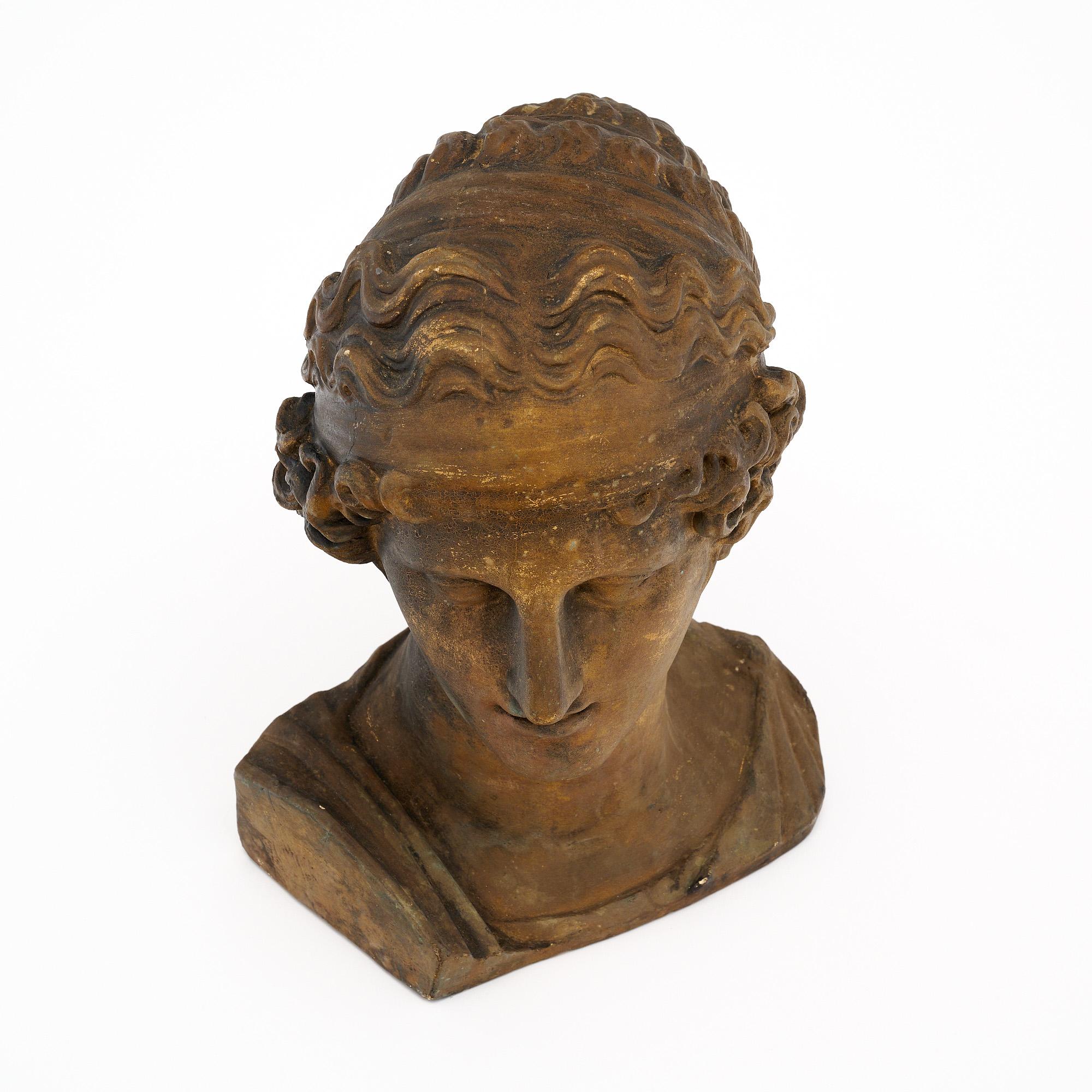 Bust from the Art Deco period in France. This piece is made of plaster and features an antique bust design. It is in very nice vintage condition with only minor surface wear consistent with age and use. The photos accurately depict the