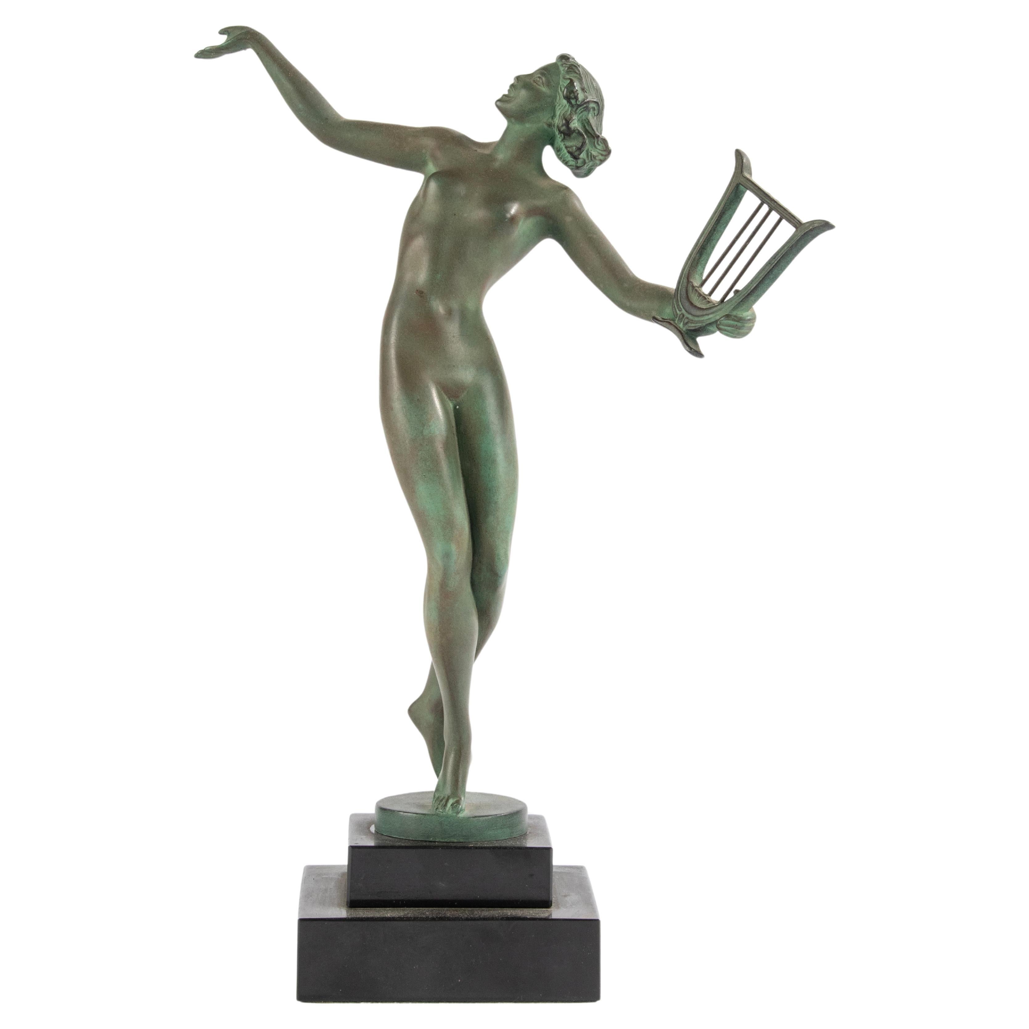 Art Deco Period Green Patinated Spelter Sculpture Woman with Harp For Sale