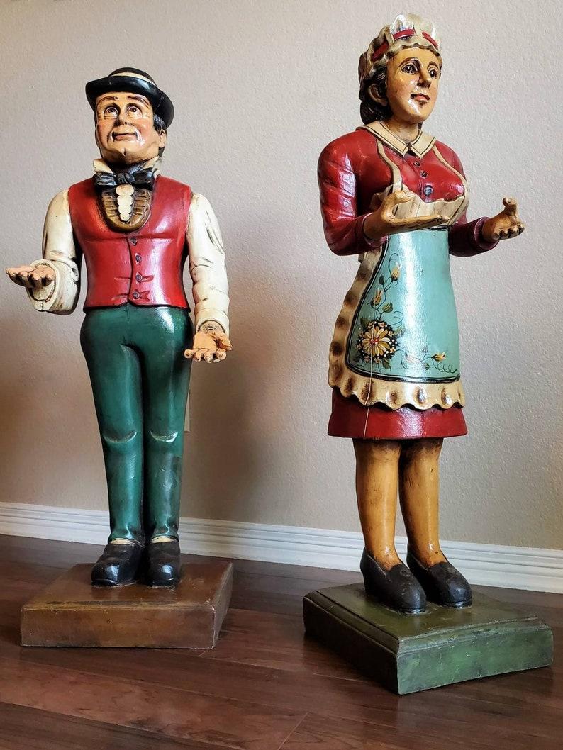 An interesting and whimsical Art Deco period hand carved and painted dumb waiter, this listing is for the butler statue only (the maid has already sold). Born in the early 20th century, the large freestanding statue figure, butler in bowler hat,