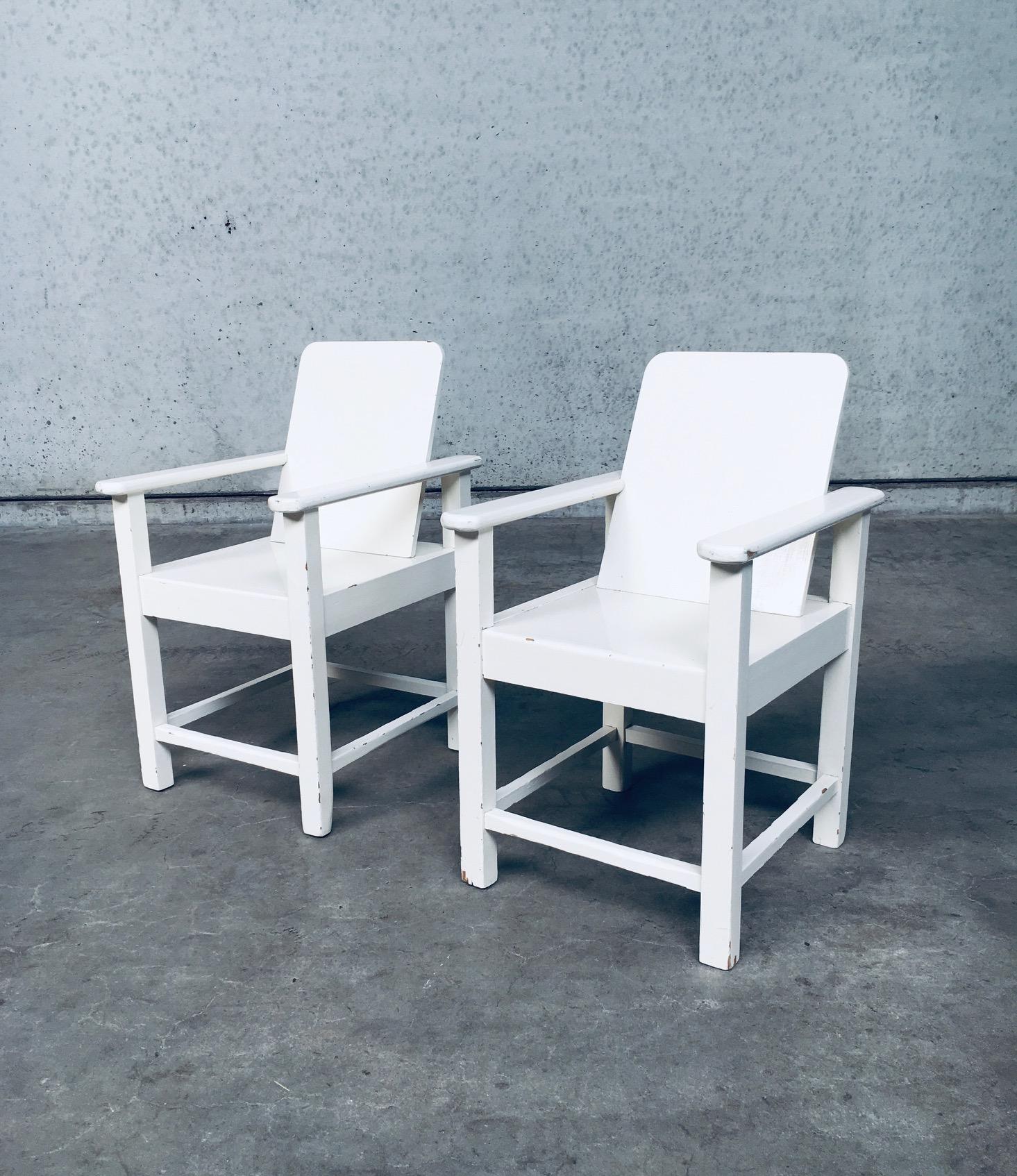 Vintage Early 20th Century Art Deco Period Handmade hand crafted Childs Size Arm Chair set of 2. Made in Belgium, 1920's. Beech wood constructed chairs with a modernist / modernism style design. Painted with a thick layer of white gloss paint. Both