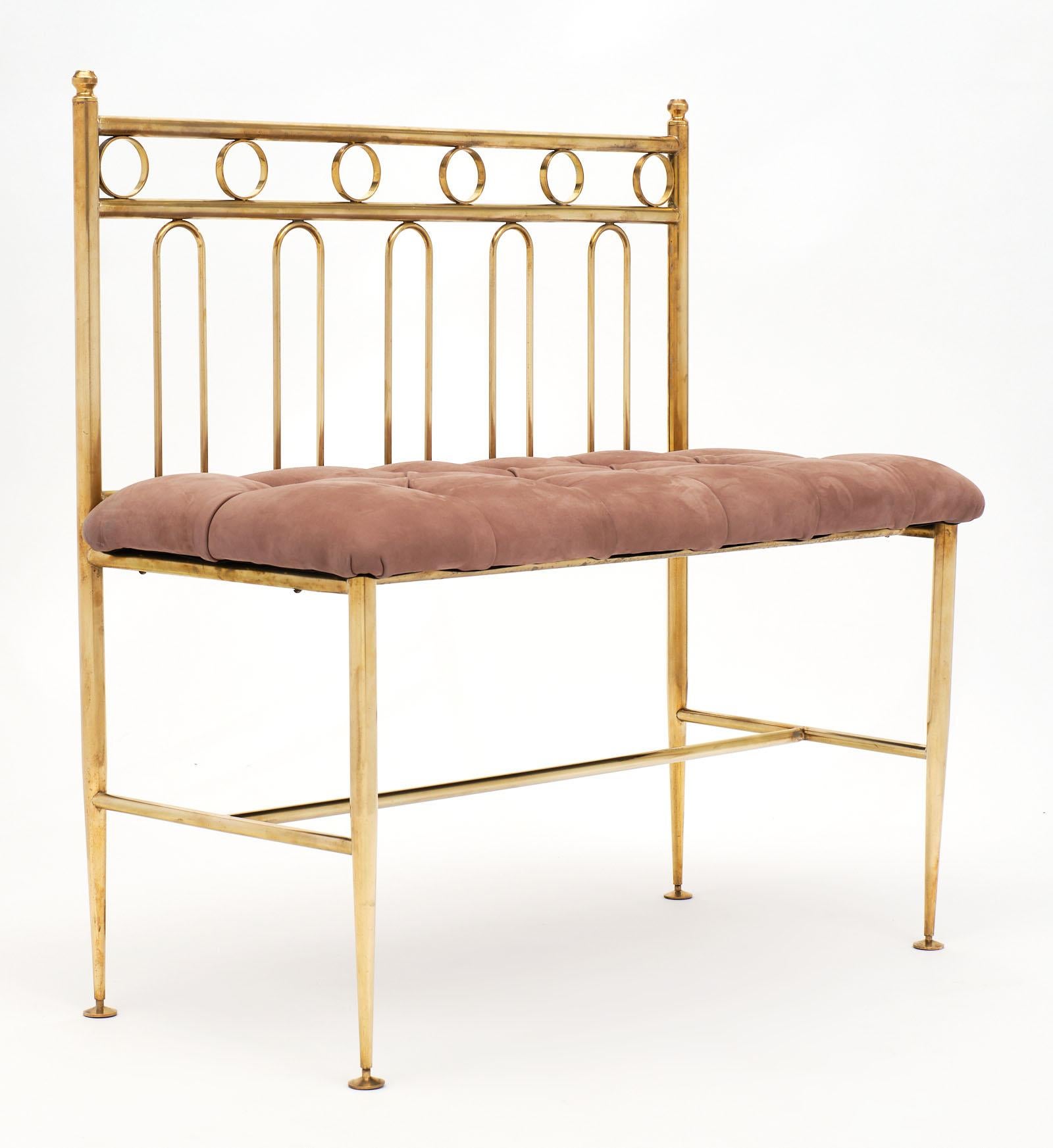 Italian Art Deco period bench made of solid brass with a tufted suede seat. We love the elegant lines and size of this piece.