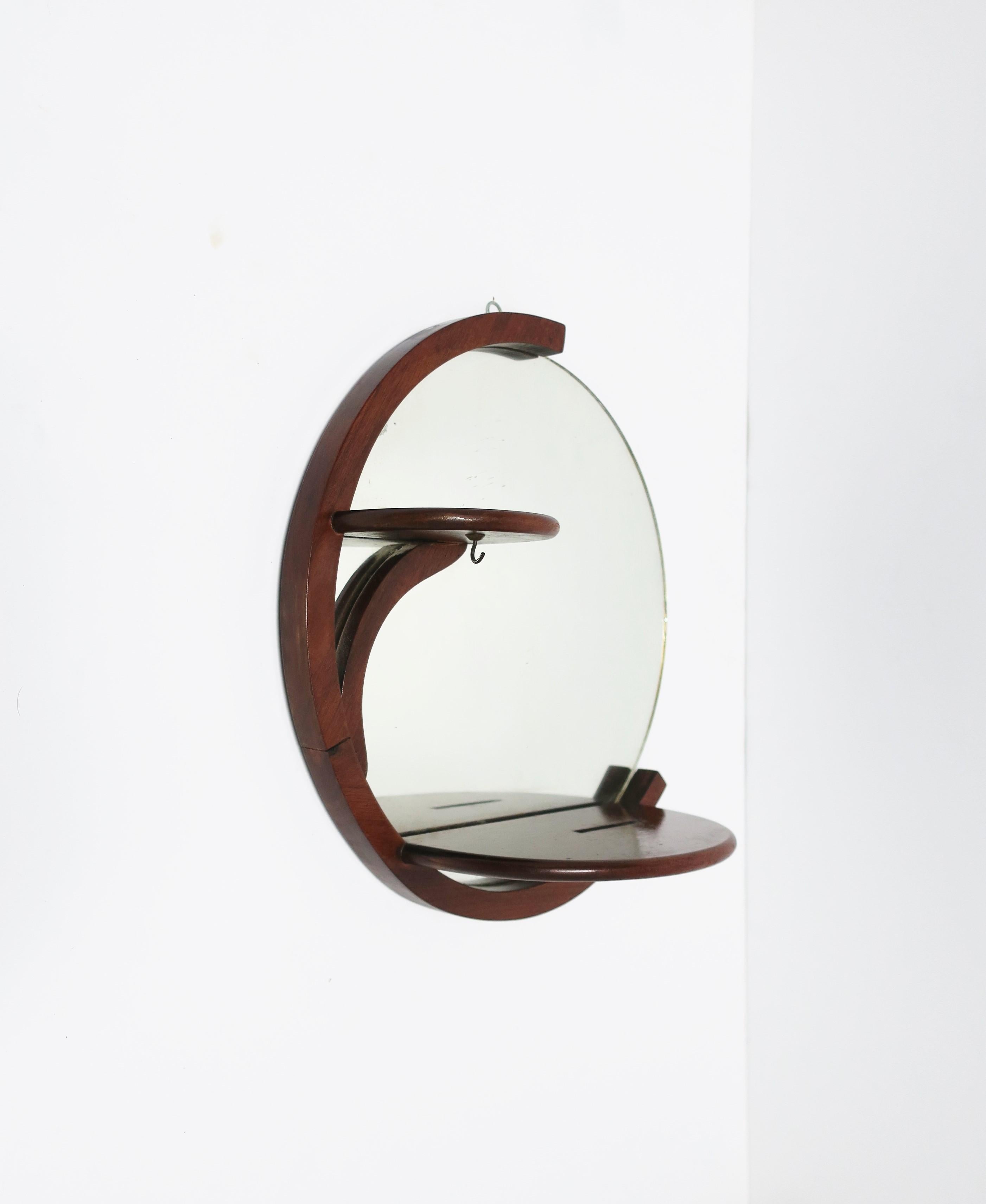 round wooden mirror with shelf