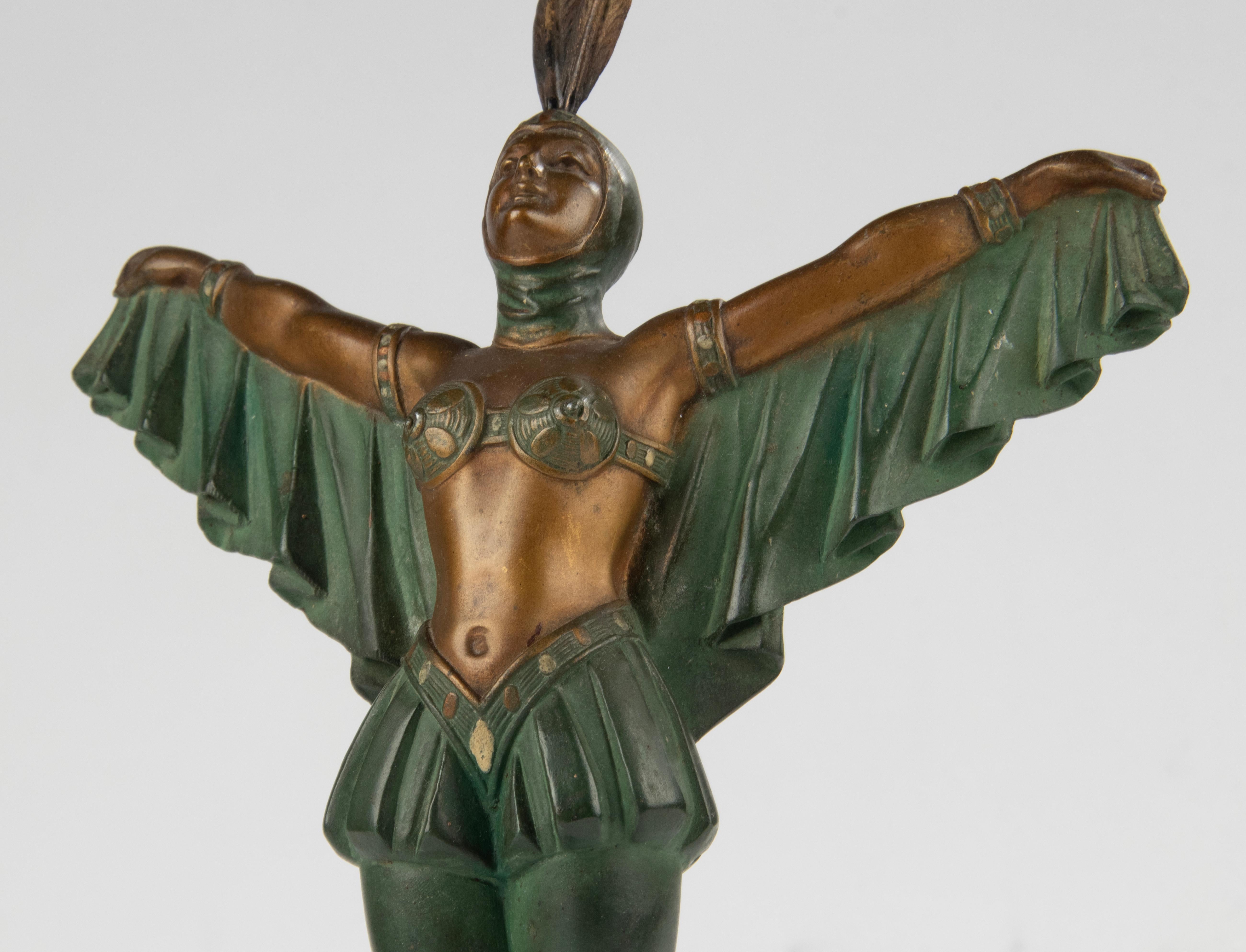 An elegant sculpture of a female dancer in Art Deco style. It's made of multi-colored patinated spelter. This dancer reflects the roaring 20's. On Port Nero Marble plinth. It has no signature. Made in France, around 1920-1930. In good vintage