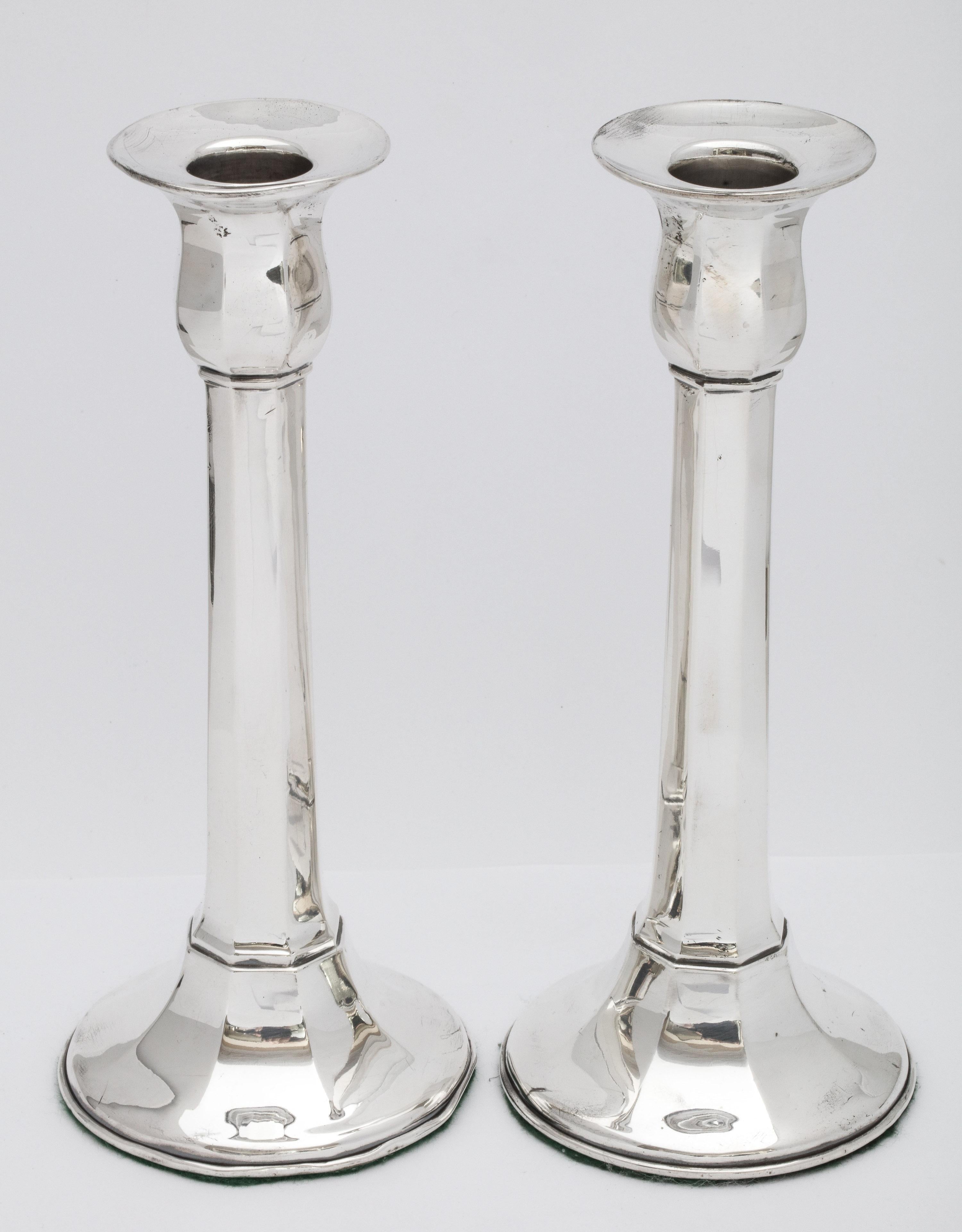 Art Deco period, sterling silver, column-form candlesticks, The Watson Company, Attleboro, Mass., circa 1920s (company hallmark on candlesticks was used from 1905-1929). Faceted design. Each candlestick measures 8 inches high x a little under 3 1/2