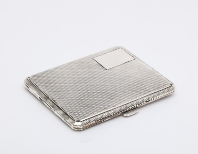 Art Deco, sterling silver cigarette case with gilt interior and hinged lid, Birmingham, England, year-hallmarked for 1927, W.T. Toghill and Co., Ltd. - makers. Sterling silver is engine turned in design. Vacant cartouche. When closed, cigarette case