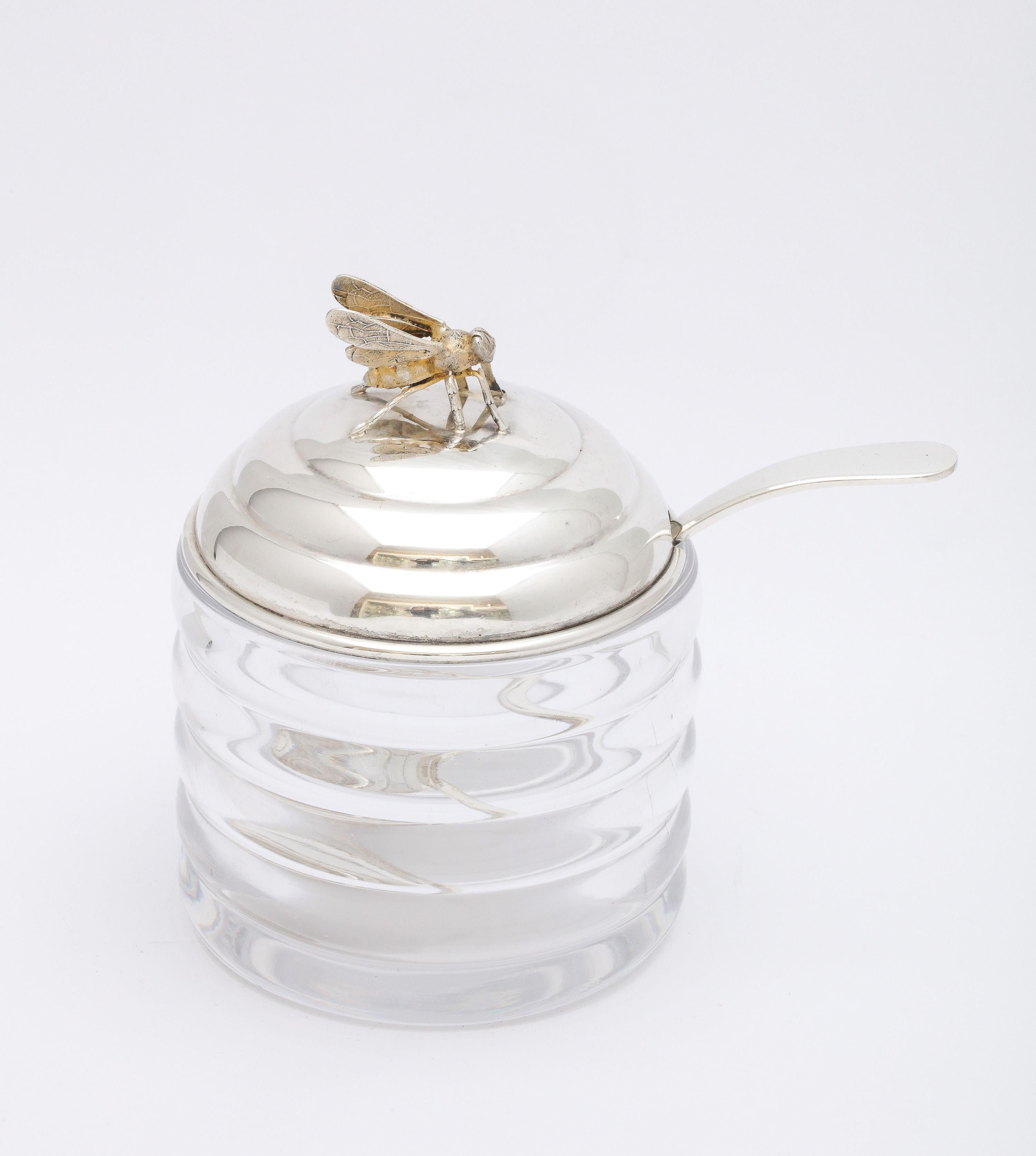 Unusual, Art Deco period, sterling silver-mounted, beehive-form honey jar, with its original sterling silver honey spoon, R. Blackinton and Co., North Attleboro, Mass., Ca. 1930's. Glass honey jar is in the form of a beehive. Sterling silver lid is