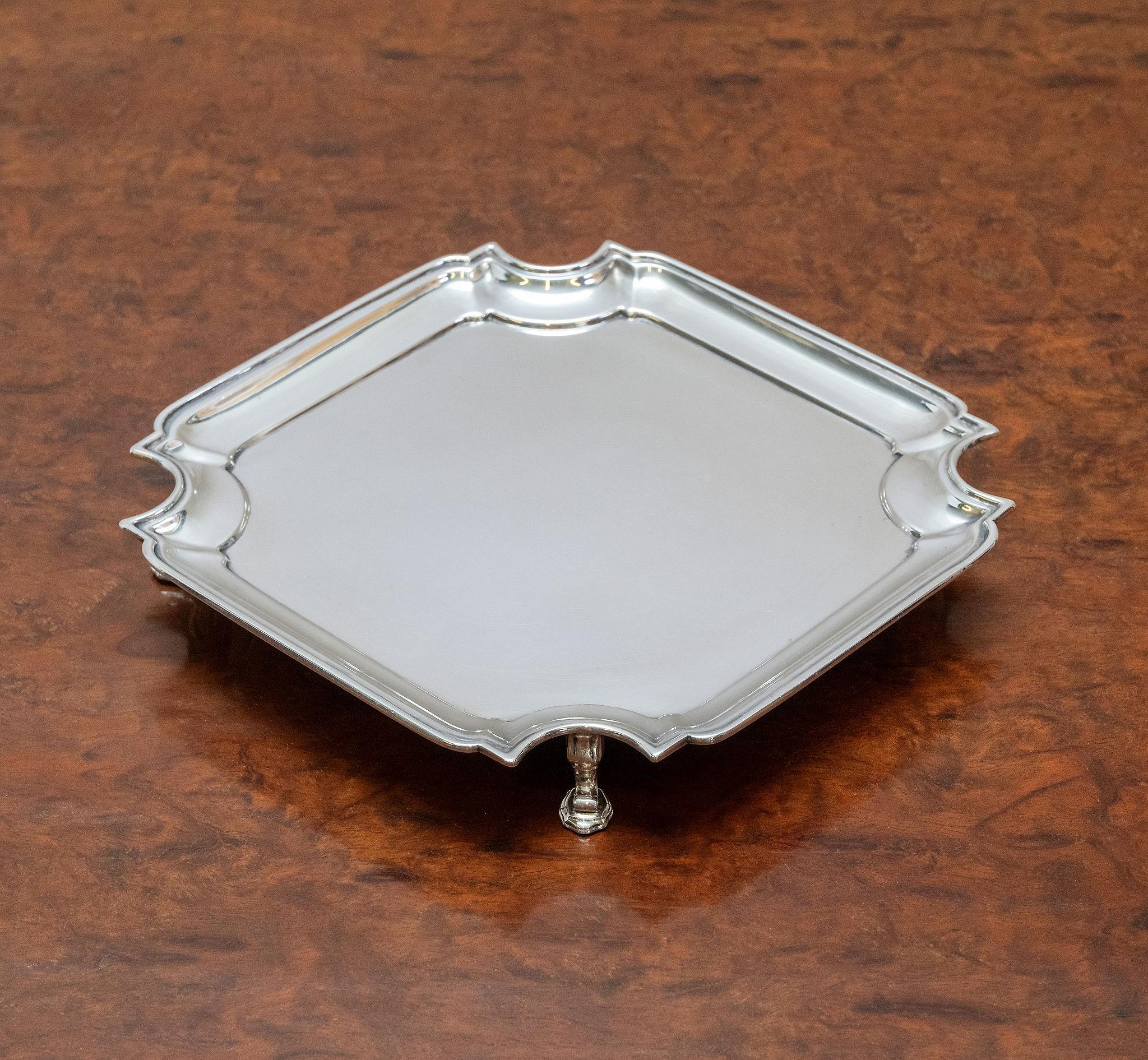 George V sterling silver small tray by Asprey & Co. Art Deco period. Fully hallmarked Birmingham 1931 and Asprey London retail mark. 

The tray is of square form with concaved corners and moulded rim, standing on four squat feet. 

With nice simple