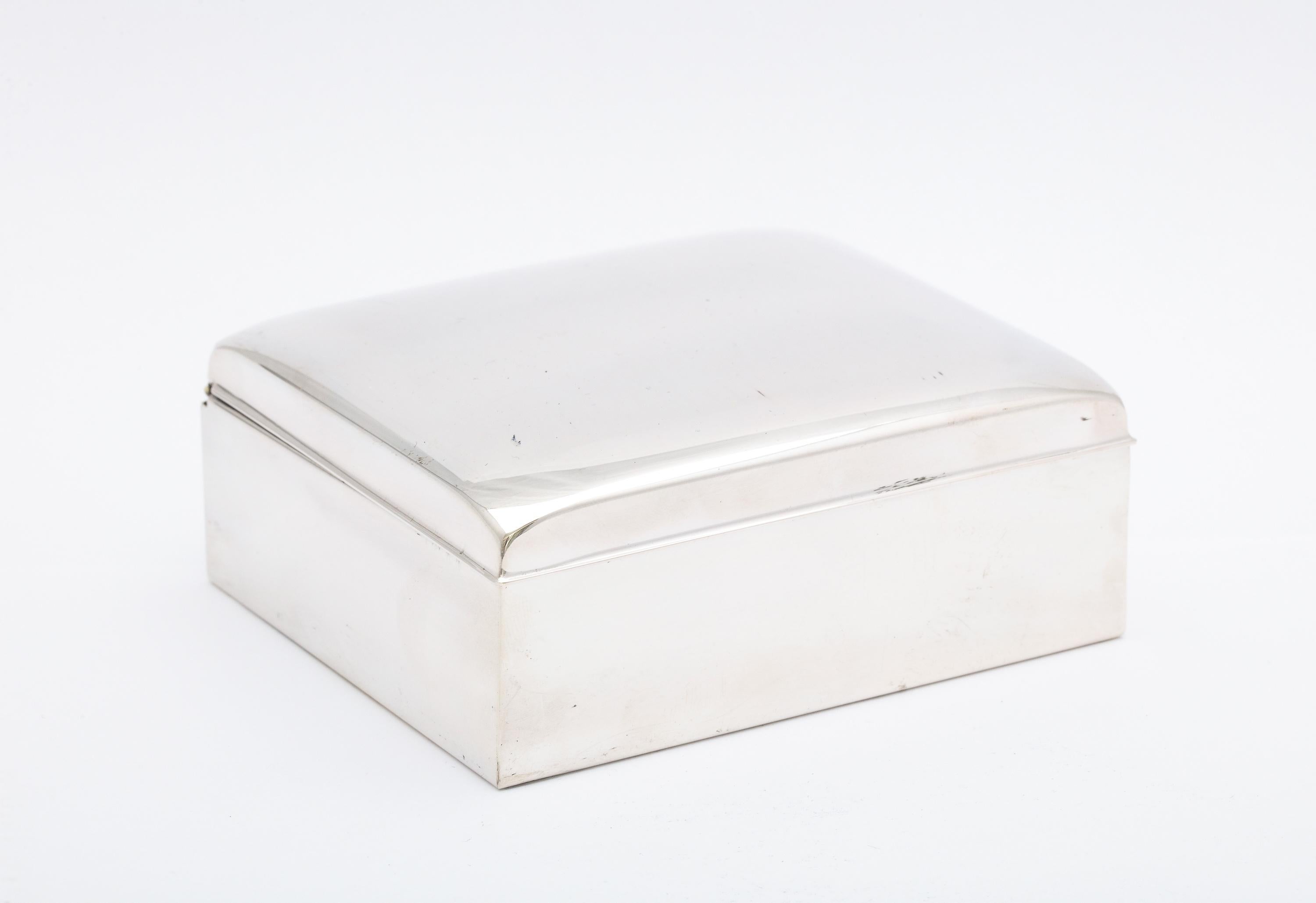 Art Deco Period, sterling silver table box with hinged lid, Poole Silver Co., Taunton Mass., Ca. 1930's. Wood lined. Underside of gracefully curved lid is lightly gilded. Underside of box is also sterling silver. Measures 4 inches wide x 3 1/2