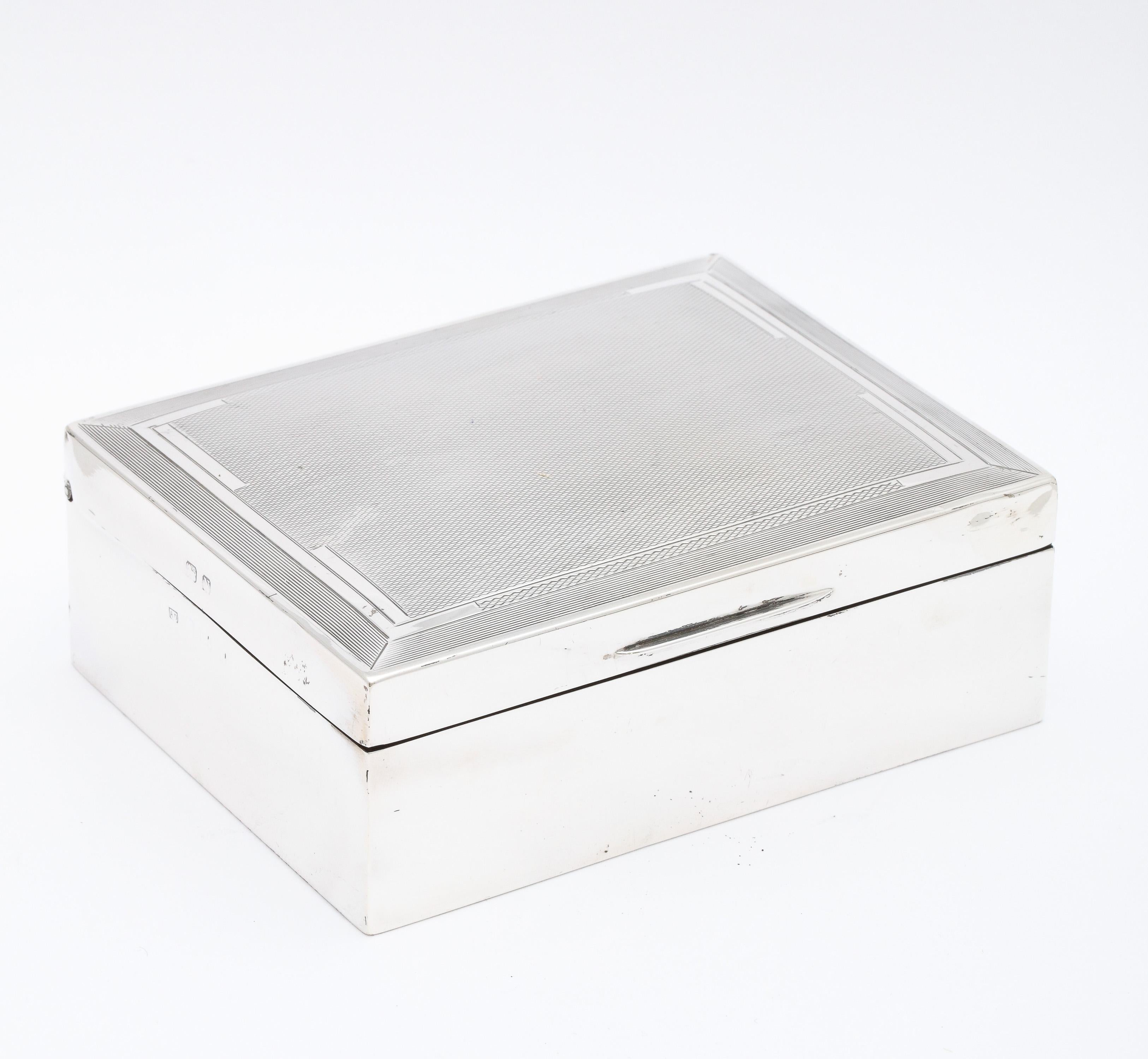Art Deco period, sterling silver table box with hinged lid and wooden interior, Birmingham, England, year-hallmarked for 1933, Auguste Dreyfus - maker. Lid is engine-turned in design. Measures 4 1/2 inches wide x over 3 1/2 inches deep x over 1 1/2