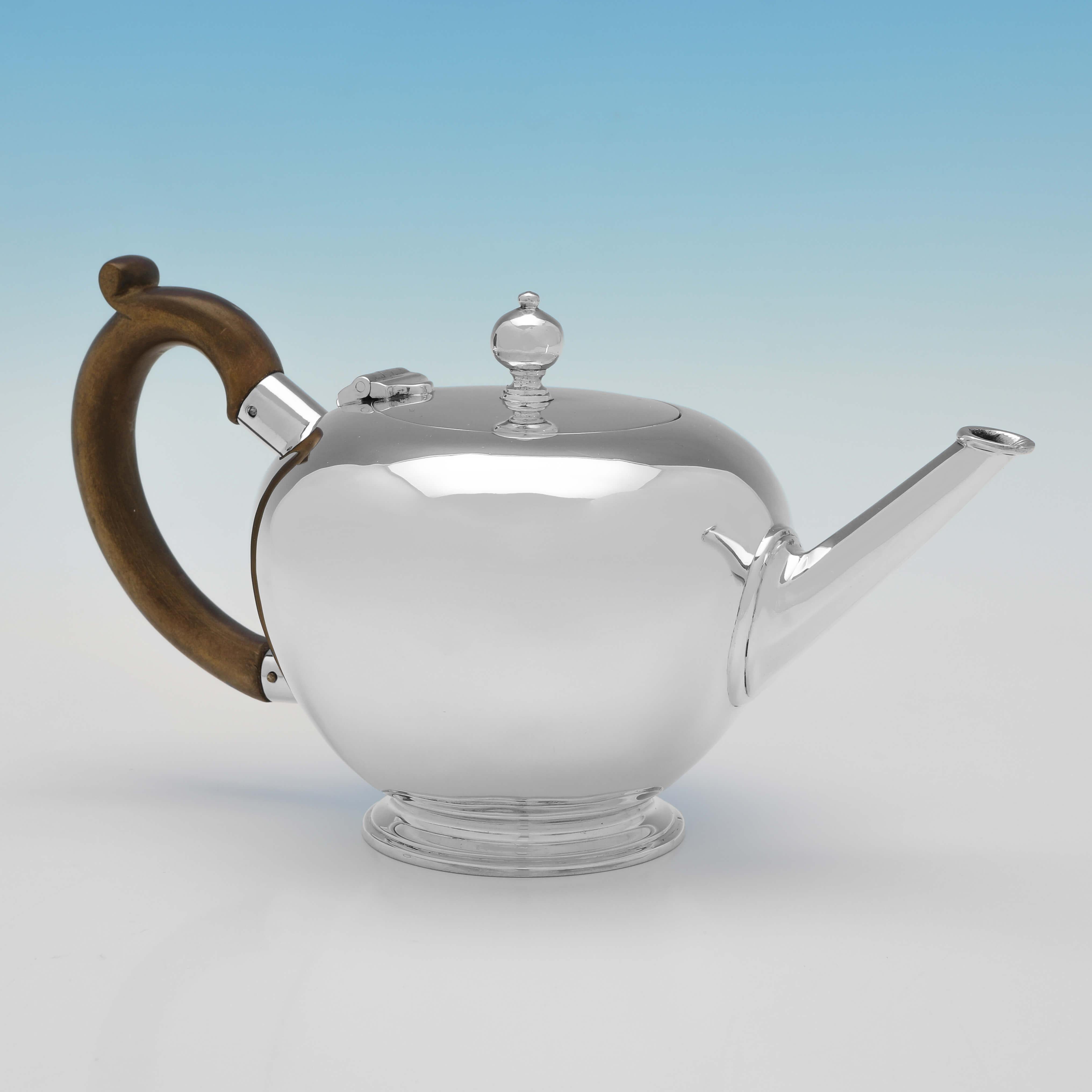 Hallmarked in London in 1937, this handsome, 3 Piece Sterling Silver Tea Set, comprises a teapot, a cream jug and a sugar bowl, all plain in style. The Teapot measures 4.5