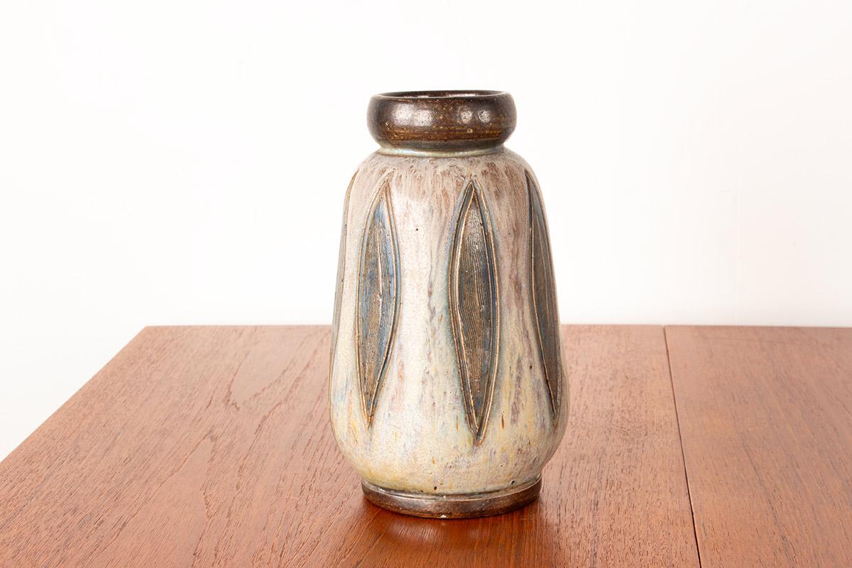 Superb Art Nouveau/Art Déco vase with this artist's distinctive designs, in the highly decorative Vallauris style. Colors: Green, Gray, and Brown.
Charles Edouard Grégoire (1901–1932) was a Belgian ceramicist active in the Châtelet region. He is