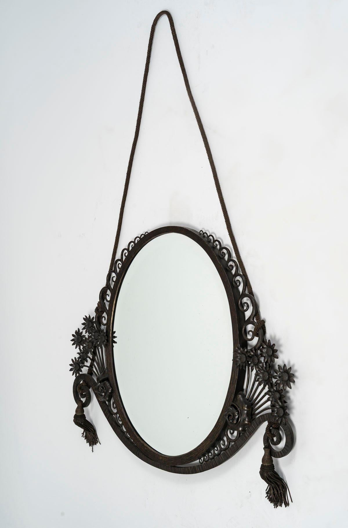 Art Deco period wrought iron mirror, 1930, bevelled mirror.

Art Deco period mirror, 1930, wrought iron and bevelled mirror.
H: 60cm, W: 80cm, D: 4cm
