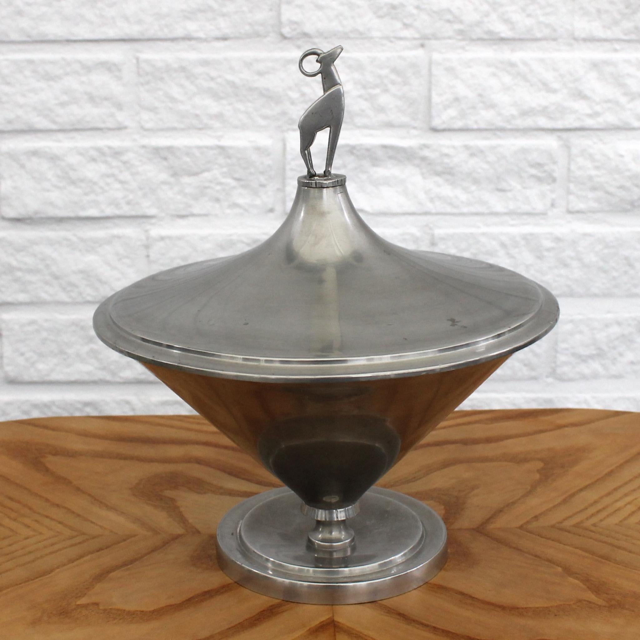 A Swedish art deco pewter bowl with lid, produced by Guldsmedsaktiebolaget GAB in the 1930’s. The lid is elegantly adorned with a decorative deer. Guldsmedsaktiebolaget, or GAB, was established back in 1868 and gained recognition, particularly for