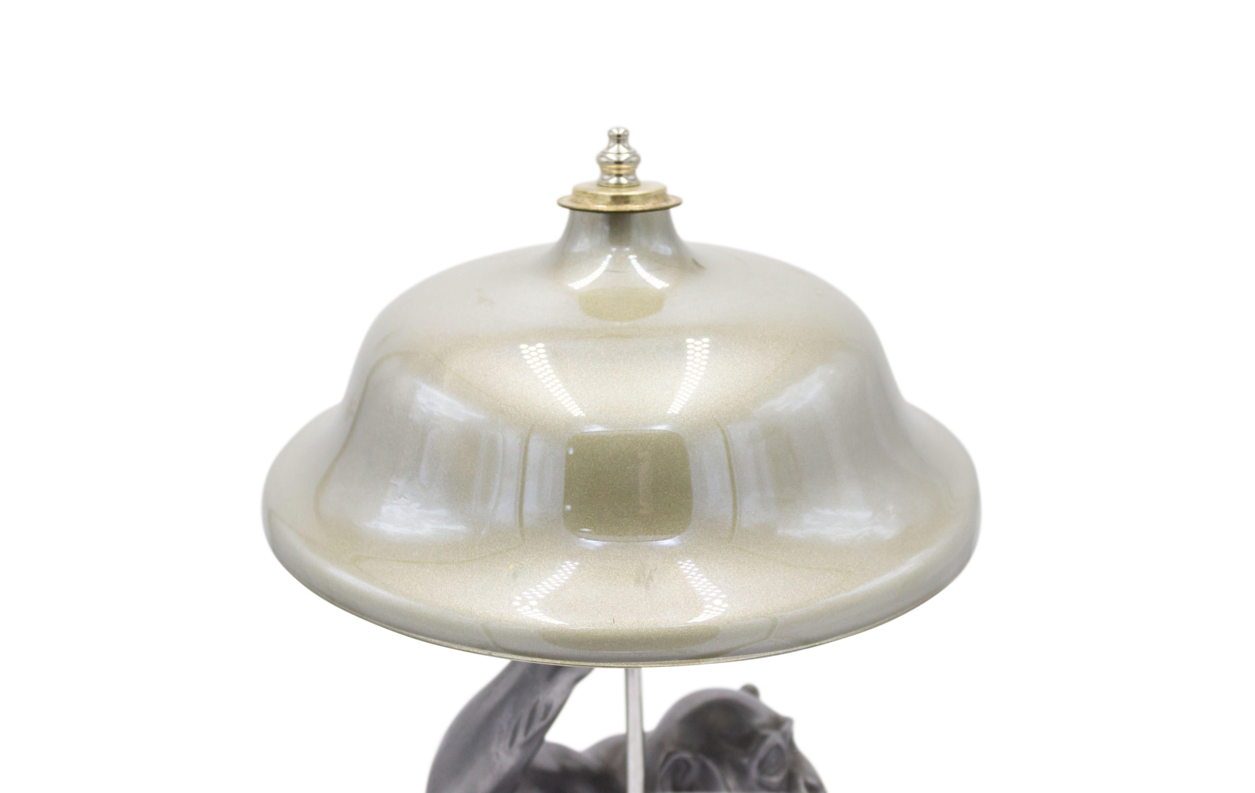 Art Deco style pewter table lamp of seated monkey on octagonal marble base.