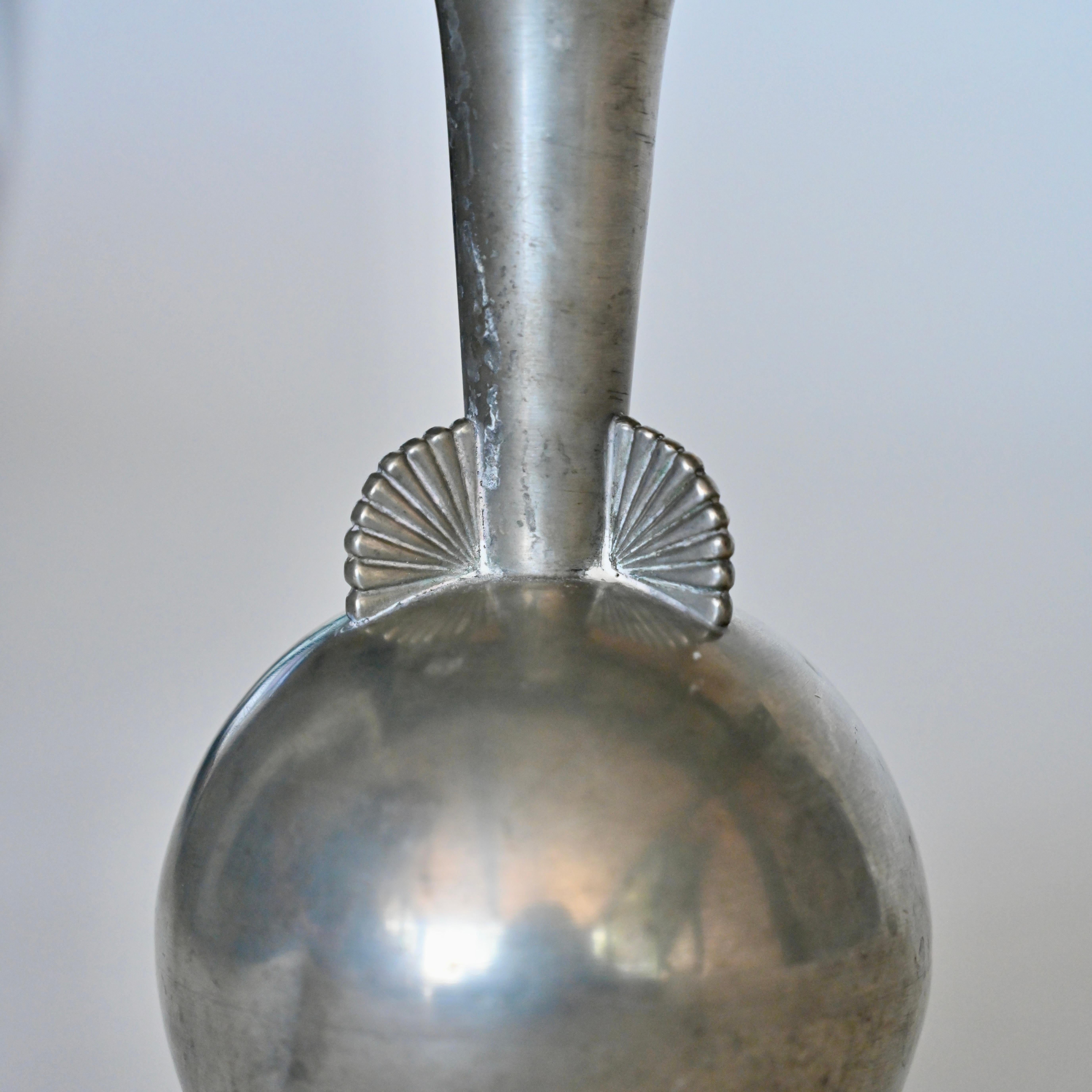 Delicate Art Deco pewter vase for C.G. Hallberg with decorative detail at vase neck. Sweden, circa 1930's. 
