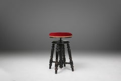 Art Deco piano stool in black lacquered wood / red velvet upholster, France 1930