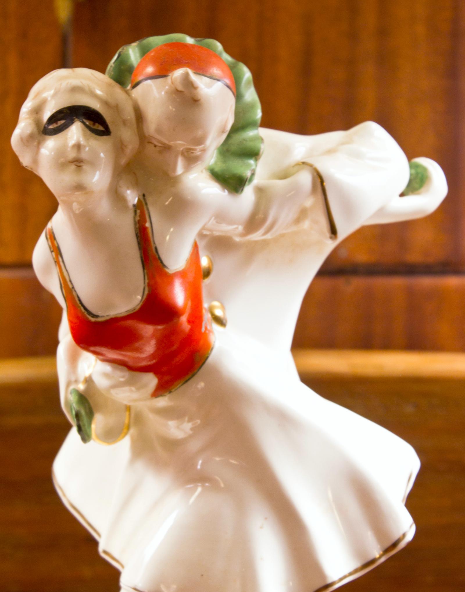 Czechoslovakian porcelain piece depicting a dancing Pierrot and Pierrette couple. Classic Art Deco in color and style. Mark on the bottom of the figurine: 