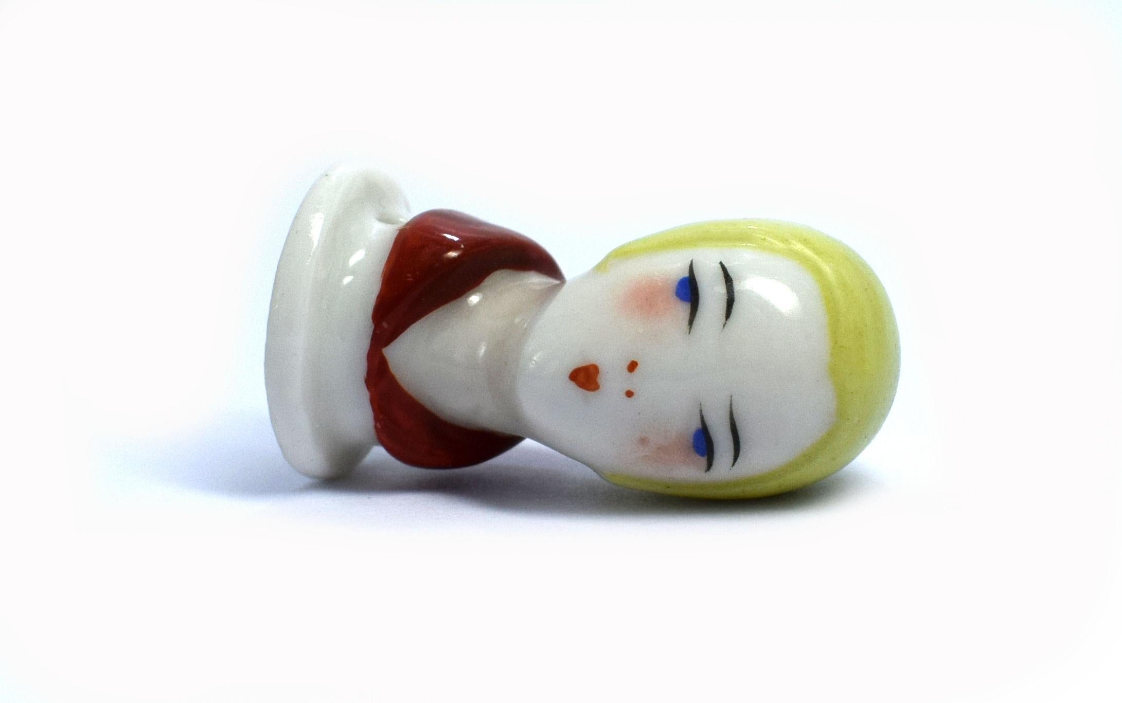For your consideration is this petite and very skillfully painted Art Deco pin cushion head manufactured by the German factory of William Goebel. Measuring just 3.5 cm in height this is a delicate little doll that is in superb condition and free