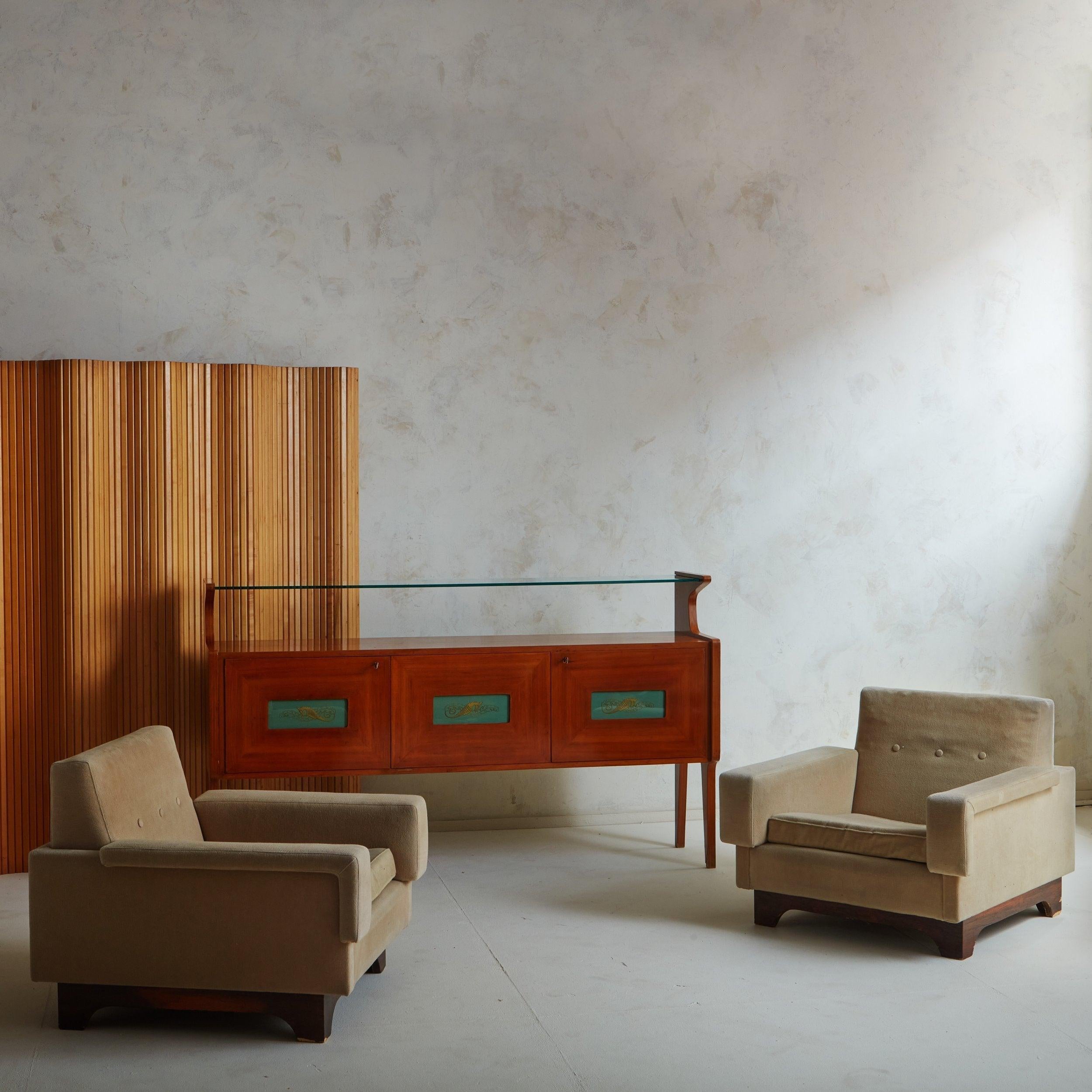 A French Art Deco room divider or screen attributed to Jomain Baumann. This wave form room divider is constructed of narrow, vertical pine slats in a warm, honey hue attached with invisible metal wire. The screen can be folded, coiled, or extended