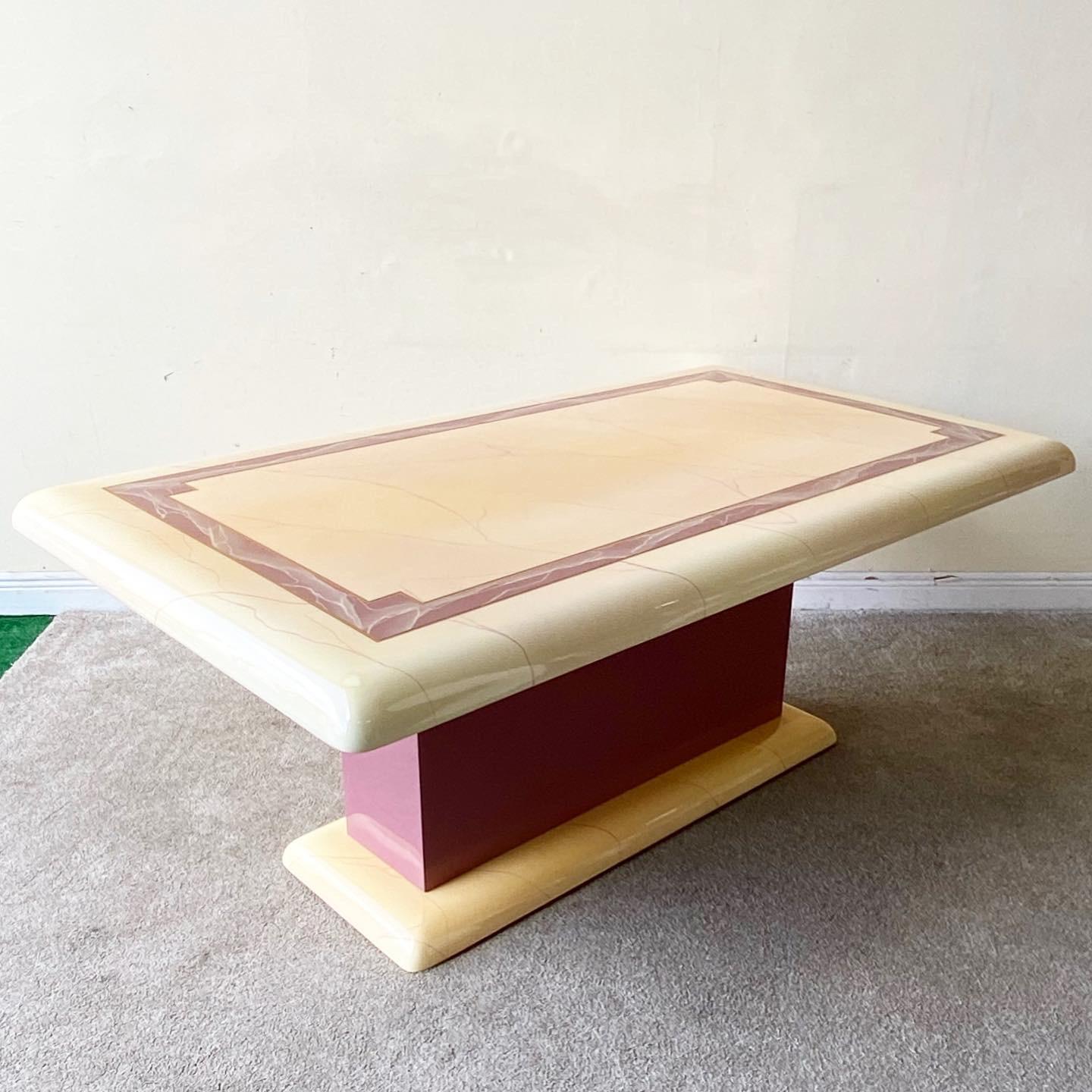 Fabulous Art Deco 1980s dining table. The table features waterfall edges and a pink and gold inlay. The wooden table was finished an epoxy coating over the top. The pedestal is a pink lacquer laminate.

Additional information:
Material: