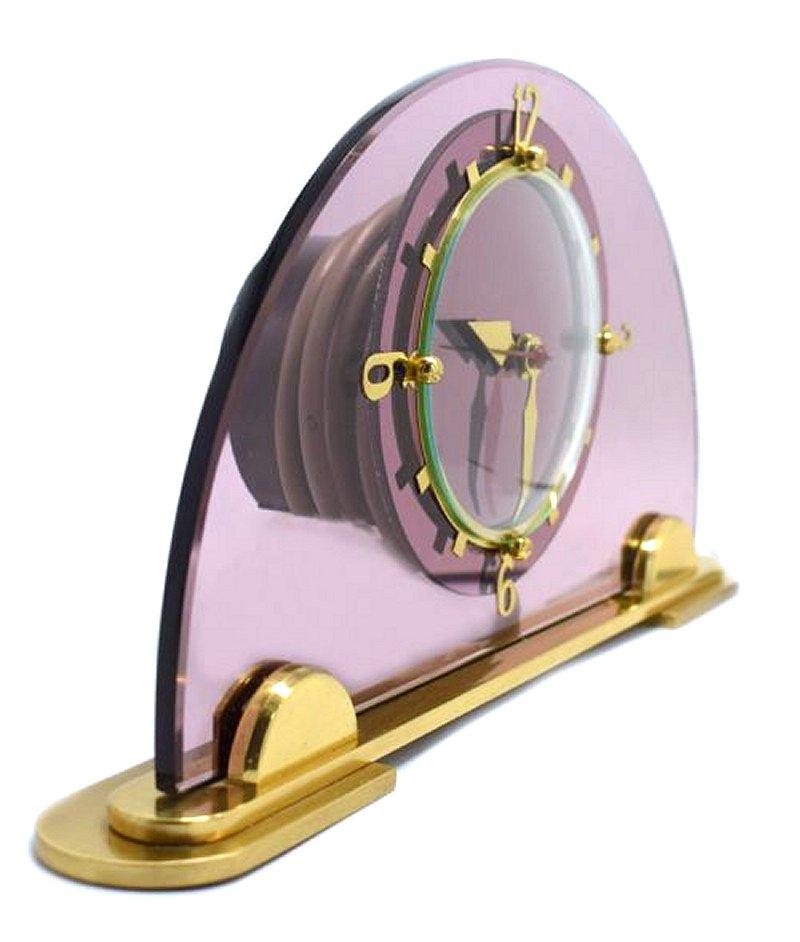 Original 1930's pink / lilac glass clock by the English clock makers Smiths. Beautiful coloured dial face which sits of a solid highly polished brass plinth with brass numerals and accents. Fabulous condition, full working order. ( We can provide a