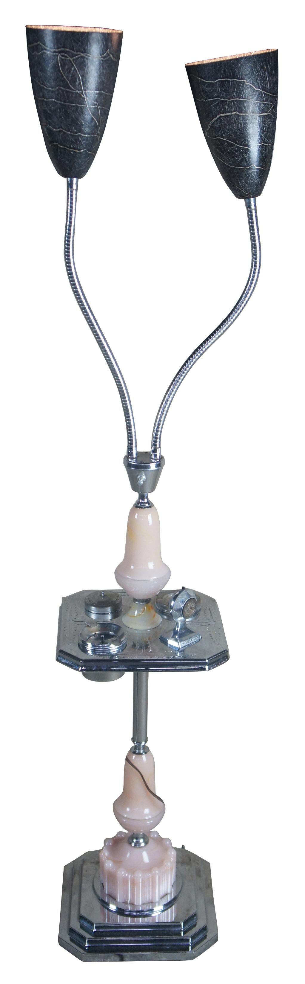 Art Deco pink glass chrome smoking table adjustable lights floor lamp ashtray

Chaplick MFG Company Art Deco smoke stand with adjustable lights. Features an ashtray, cigarette holder and lighter. Made from glass and chrome.