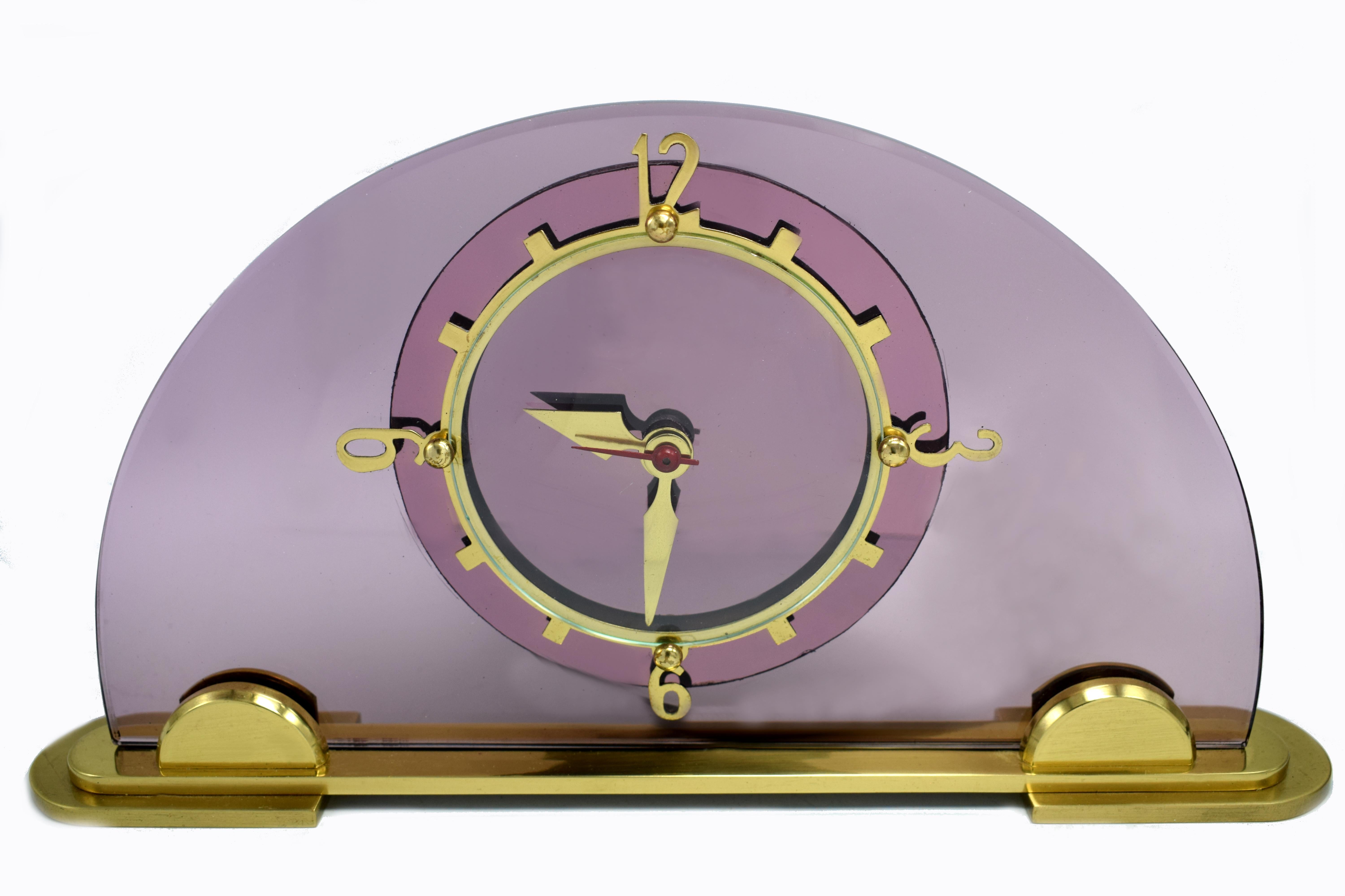 Original 1930's pink / lilac glass clock by the English clock makers Smiths. Beautiful coloured dial face which sits of a solid highly polished brass plinth with brass numerals and accents. Fabulous condition, full working order. ( We can provide a