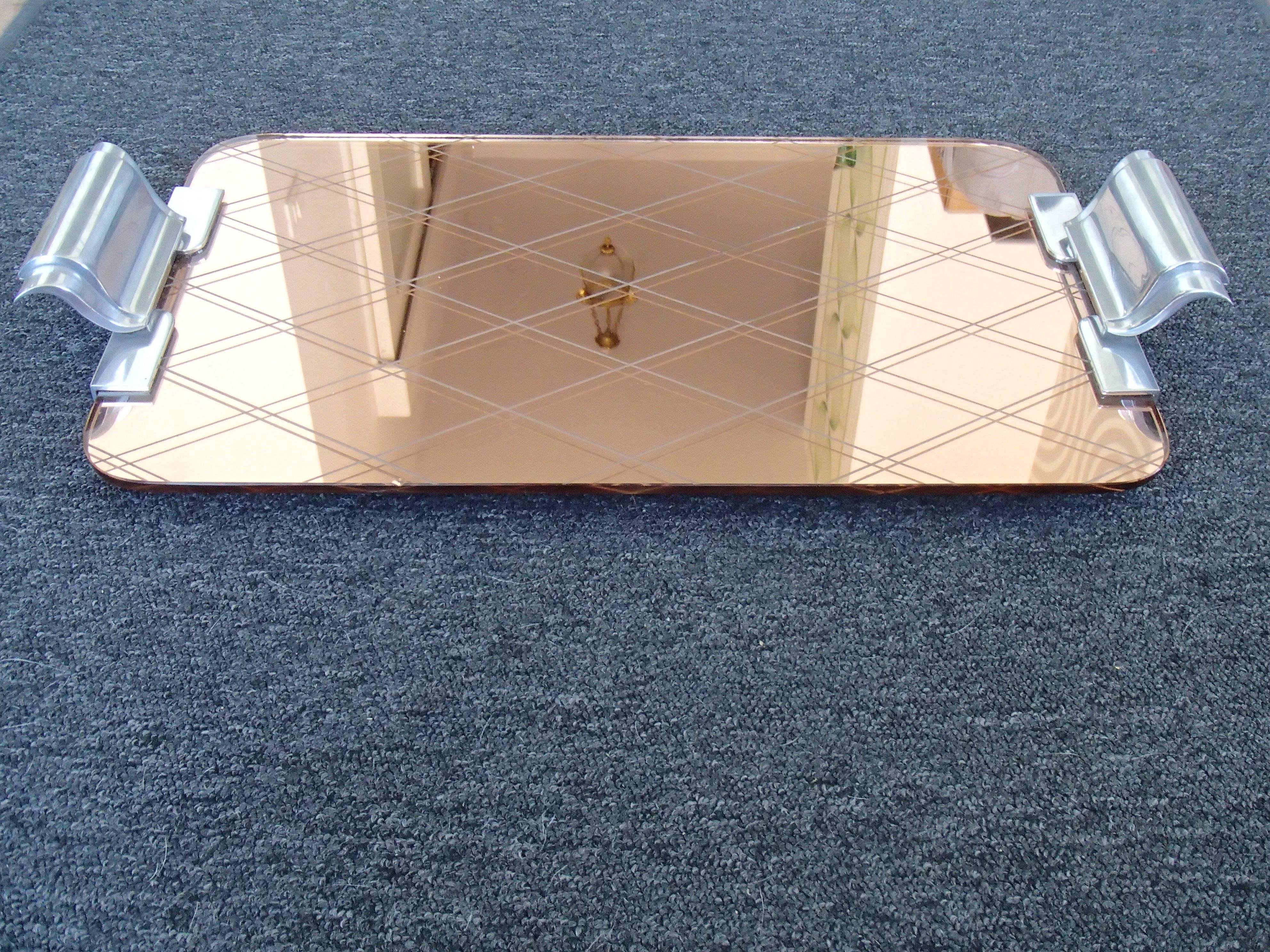 Art Deco pink mirror engraved rhomboids serving tray with aluminium handles.