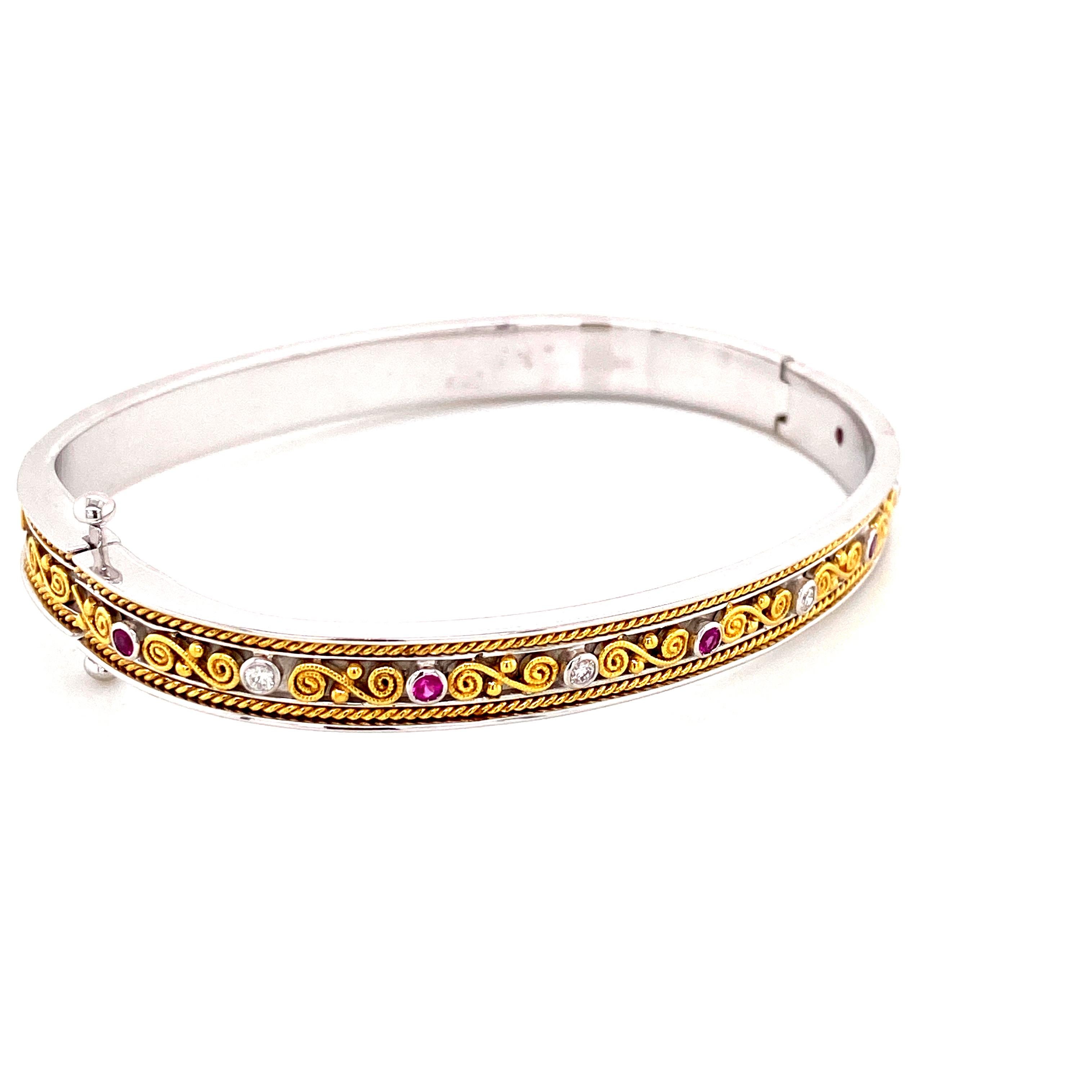 Art-Deco Style Pink Sapphire and White Diamond Gold Bangle:

An elegant bangle, it features 5 pink sapphires weighing 0.15 carat and 4 white round brilliant diamonds weighing 0.10 carat. The pink sapphires are of vivid colour, with excellent lustre