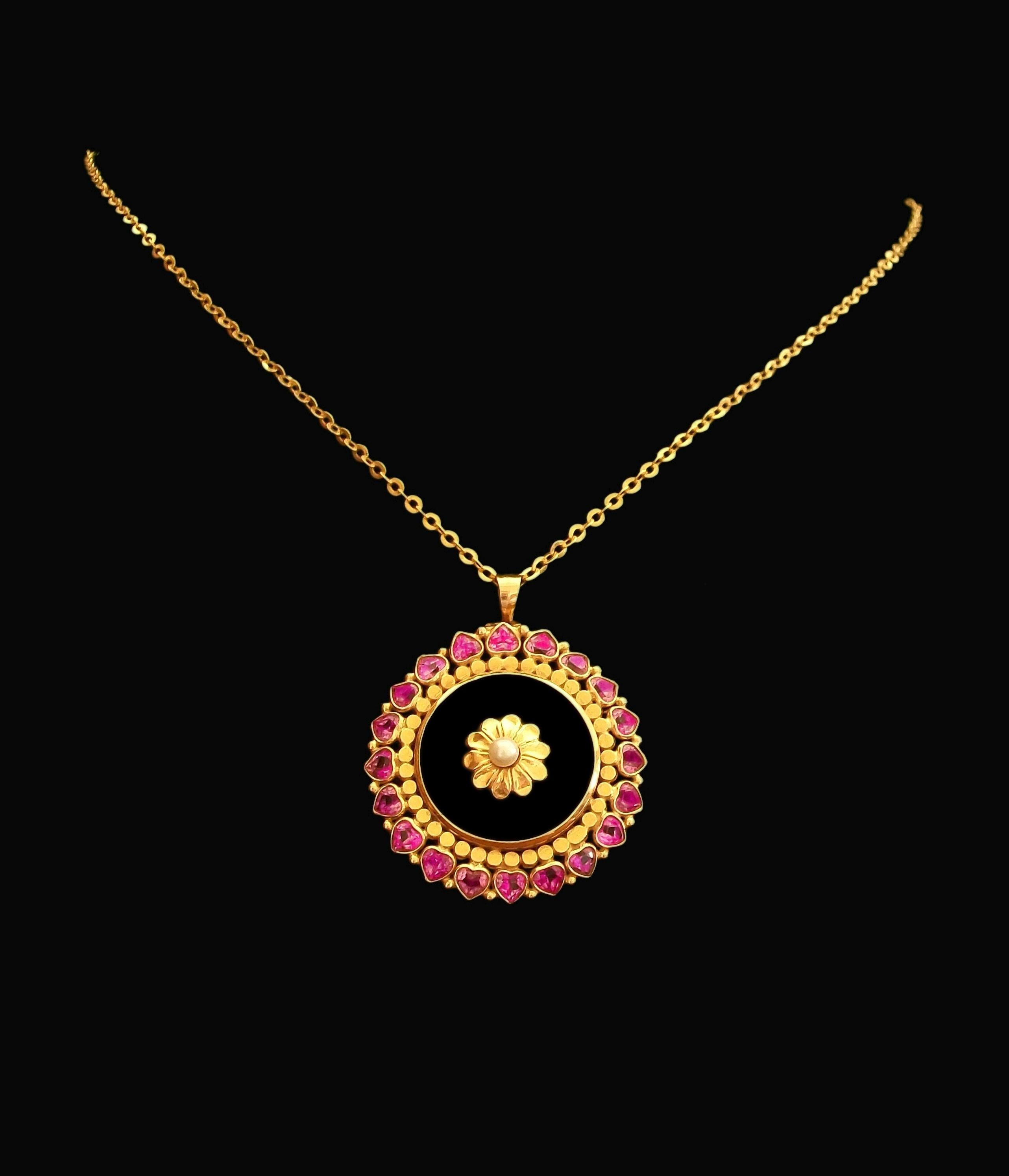 Art Deco 18K yellow gold circle pendant - the perimeter with 20 heart shaped bezel set Pink Sapphires (each 3.5 mm. x 4 mm. x 2.5 mm. deep - approximately 0.23 carats each - 4.6 carats total) set against a solid gold circle border - natural polished