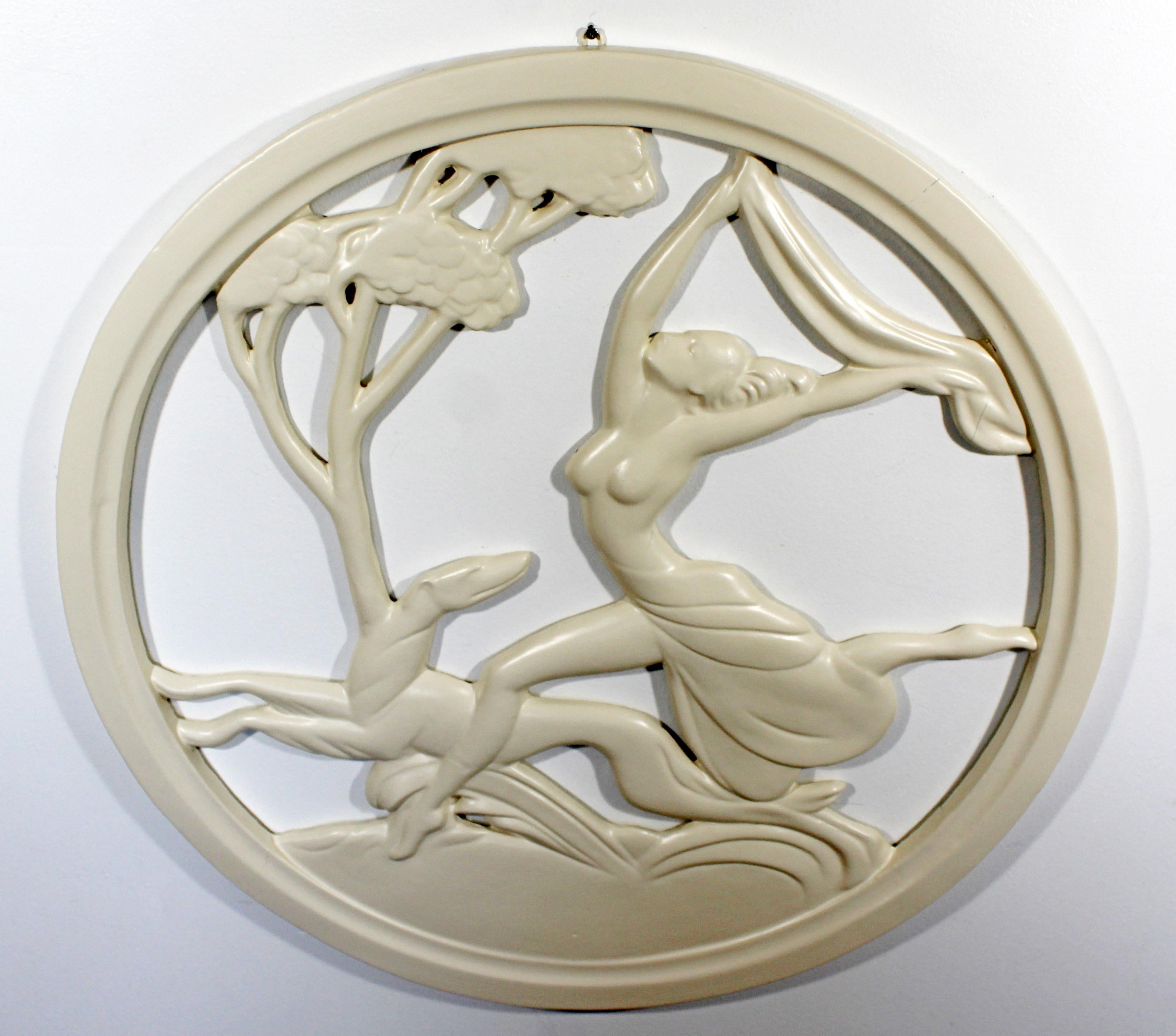 For your consideration is a lovely, circular wall sculpture, depicting a woman running with a greyhound. In good antique condition. The dimensions are 25