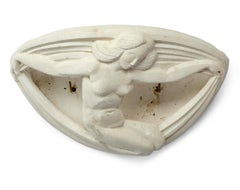 art deco plaster sconce decorated with a dwarf holding drapes circa 1930