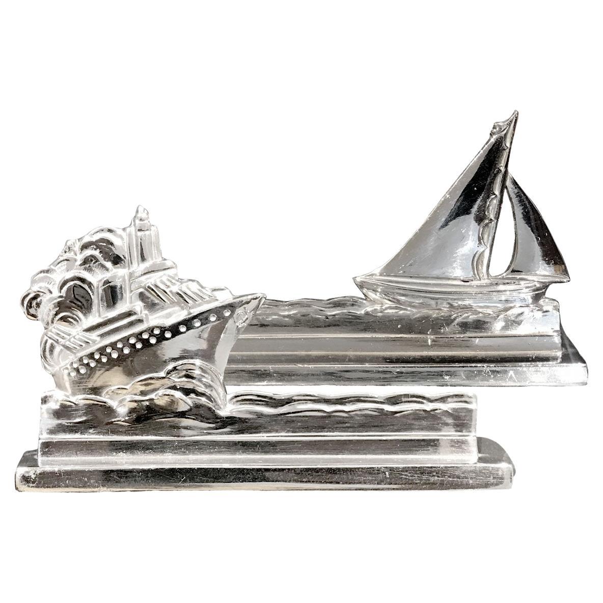 Art Deco set of 12 different boat-shaped and ship-shaped knife holders are chromium-plated. 
The set is composed of 6 pairs of several types of boats such as a ship, a liner, a cruise ship, different sailboats etc. perfect to create an original
