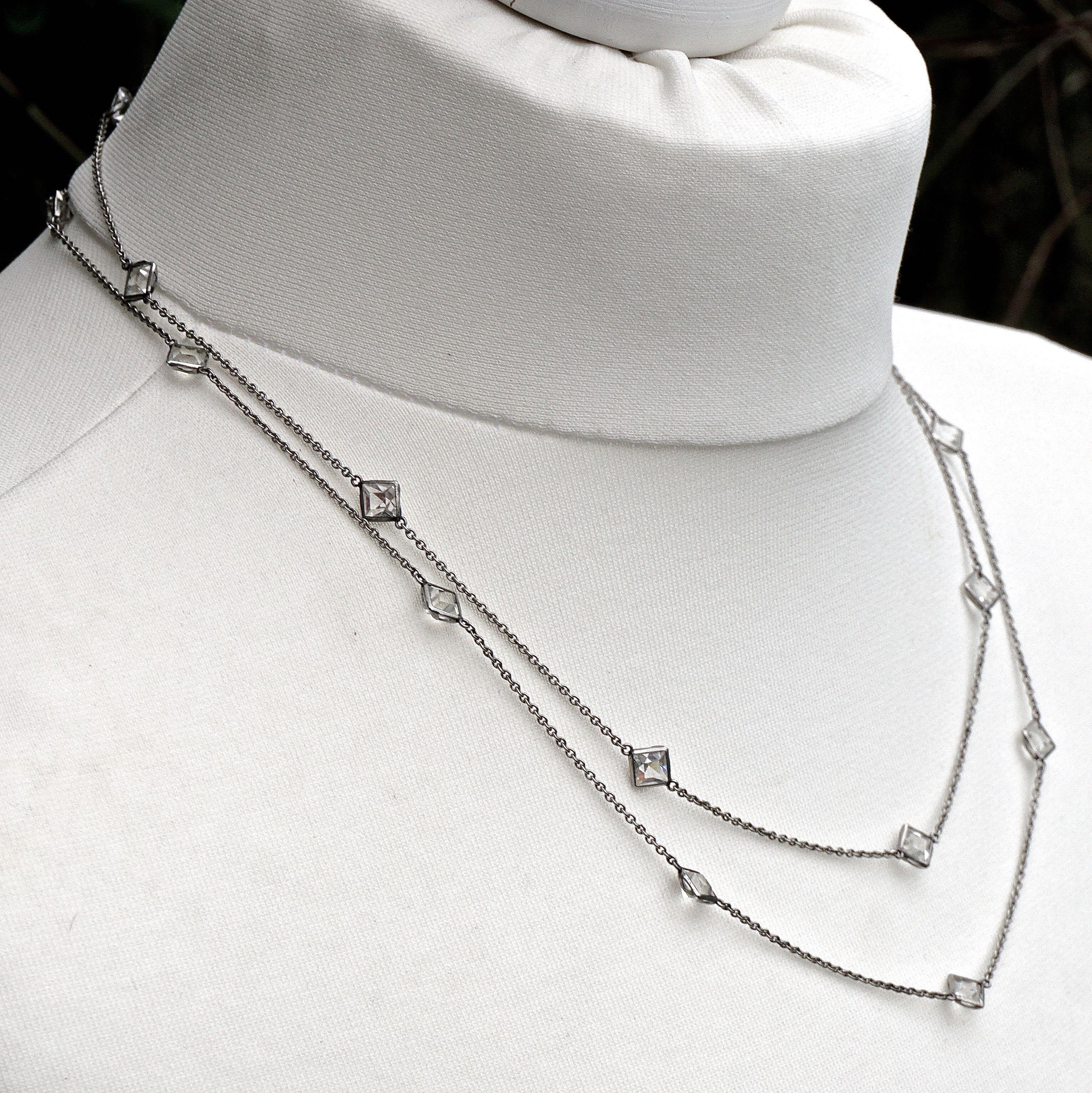 
Art Deco Platinon chain necklace, featuring beautiful square bezel set clear crystals. The faceted crystals are raised at the front and pointed at the back, for maximum sparkle. Length 102.5cm / 40.35 inches, and the crystals are 5mm / .19 inches