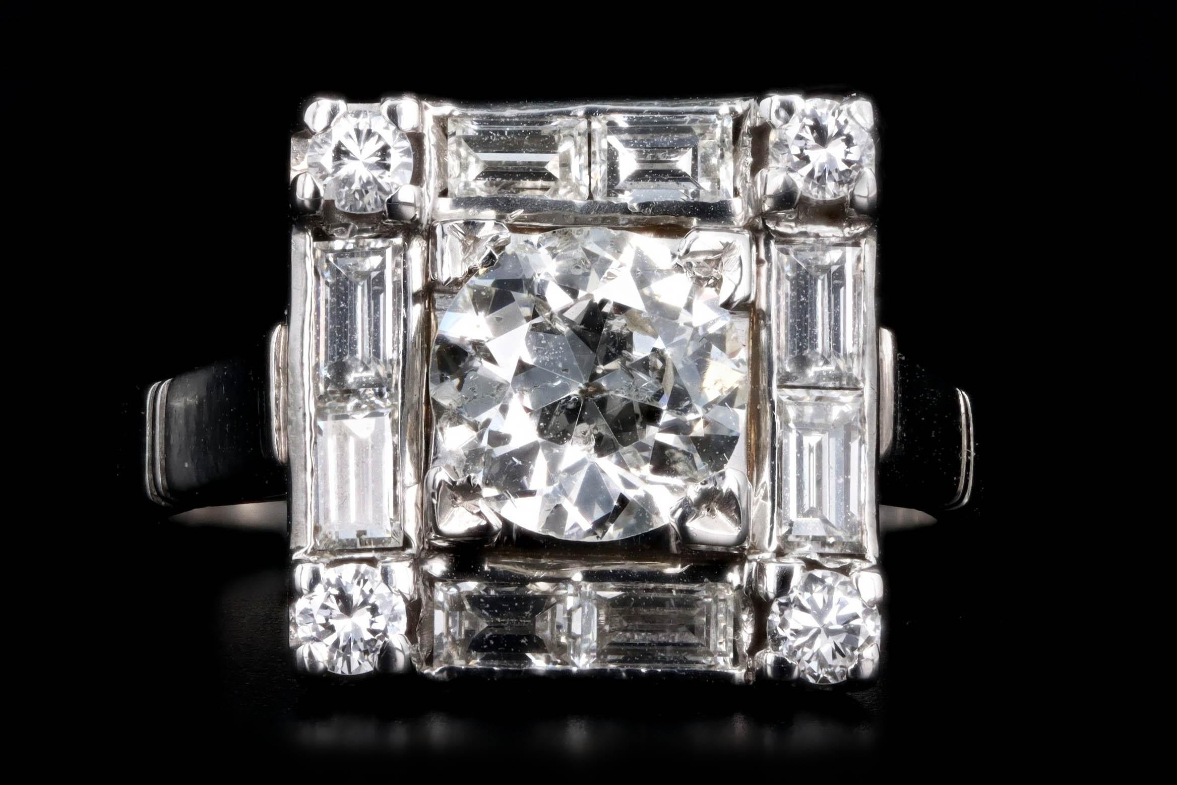 Era: Art Deco

Composition: Platinum

Primary Stone: Old European Cut Diamond

Carat Weight: Approximately 1 Carat 

Color/ Clarity: I / I1

Accent Stone: Four Round & Eight Baguette Cut Diamonds

Carat Weight: Approximately .65 Carats in