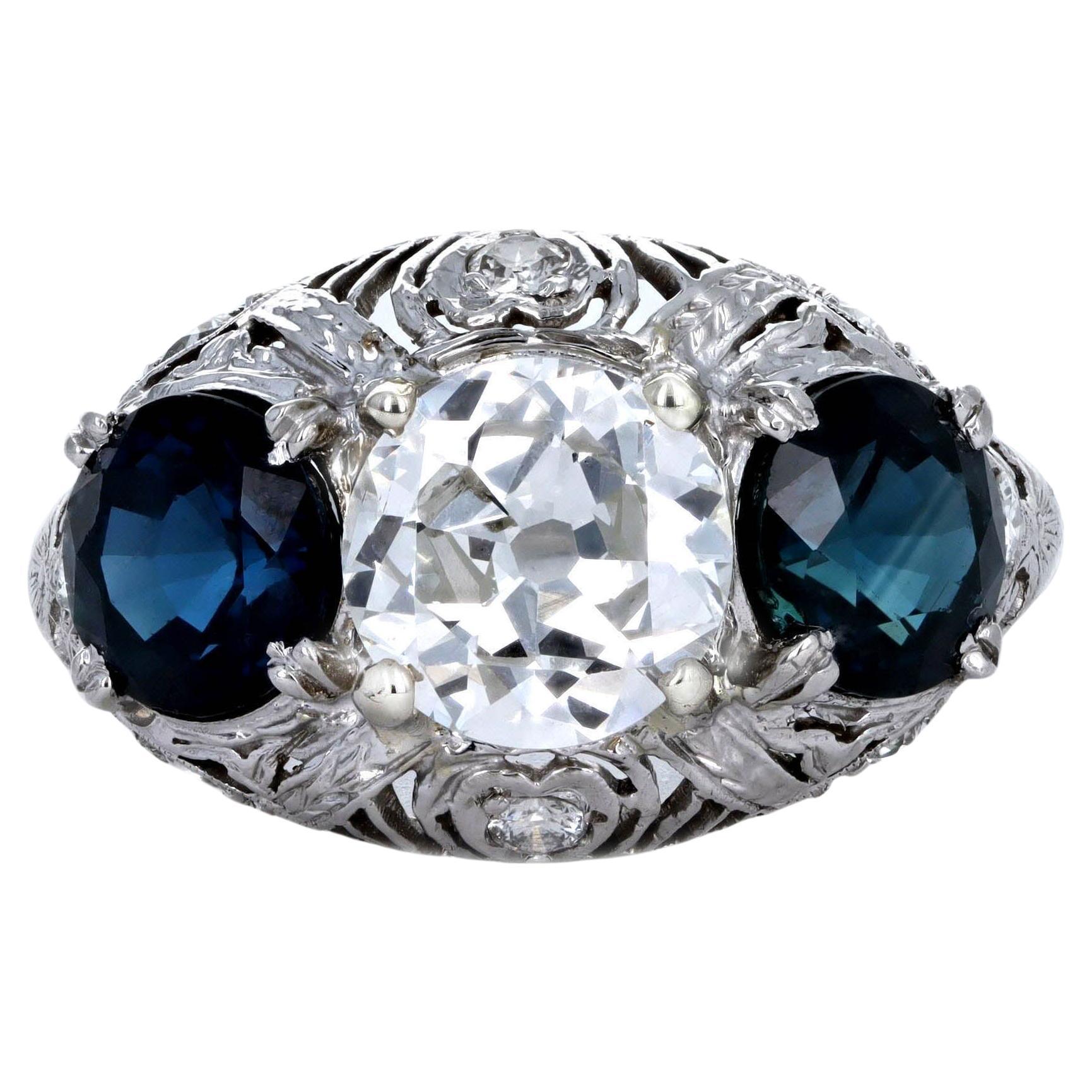 Art Deco Platinum 1.47 Carat Old European Diamond Three Stone Sapphire Ring For Sale