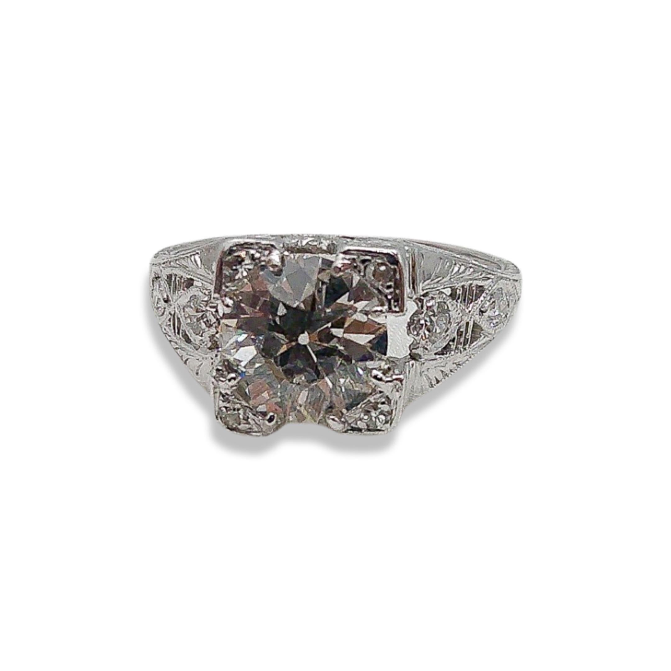 Step back in time and bask in the glamorous shimmer of the Roaring Twenties with this 1.47CT Art Deco Diamond Ring, exquisitely set in Platinum. A genuine treasure, this ring is an ode to an era when style, sophistication, and lively spirit danced
