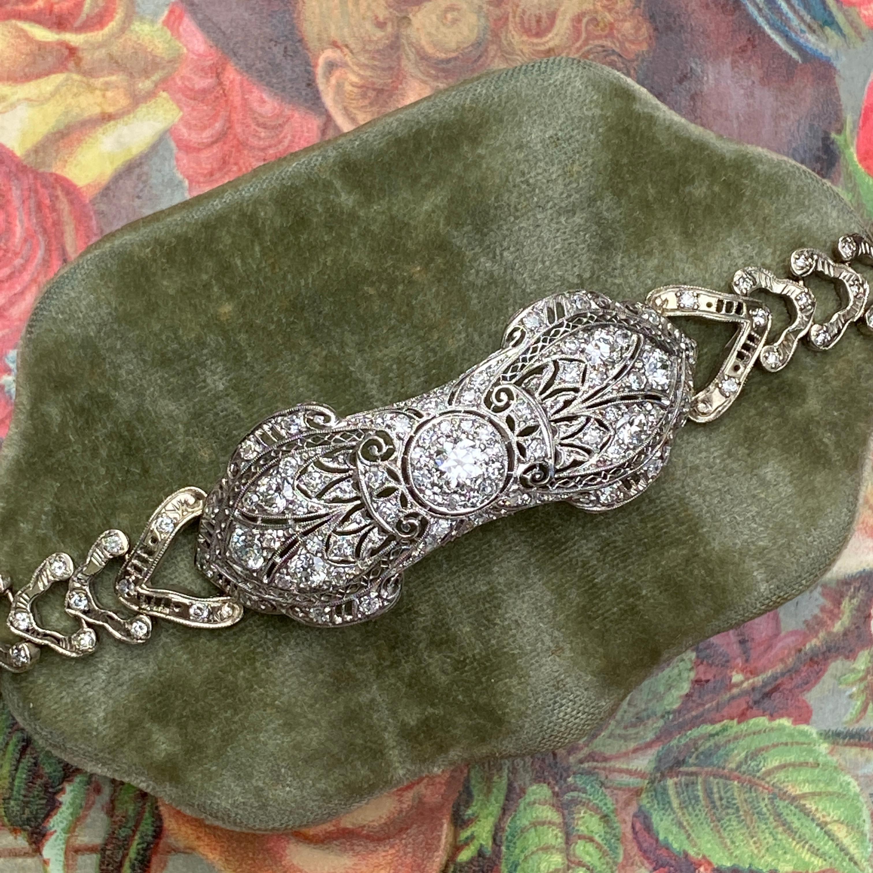 Details:
Stunning Art Deco Platinum and 14K White gold Diamond bracelet. This beautiful bracelet has lots of sparkle and bling! Just over 3 carats of diamonds—a mix of Old European cuts, single cuts, and round brilliant. The center of the bracelet